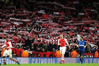 LONDON, ENGLAND - FEBRUARY 25:  Monaco fans cheer on their team during the UEFA Champions League round of 16, first leg match between Arsenal and Monaco at The Emirates Stadium on February 25, 2015 in London, United Kingdom.  (Photo by Clive Mason/Getty I