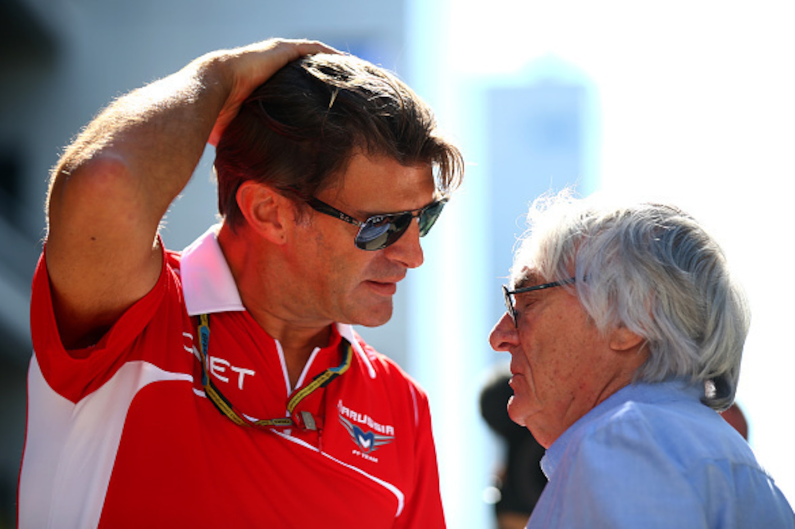 SOCHI, RUSSIA - OCTOBER 09:  F1 supremo Bernie Ecclestone speaks with Graeme Lowdon, President and Sporting Director of Marussia in the paddock during previews ahead of the Russian Formula One Grand Prix at Sochi Autodrom on October 9, 2014 in Sochi, Russ