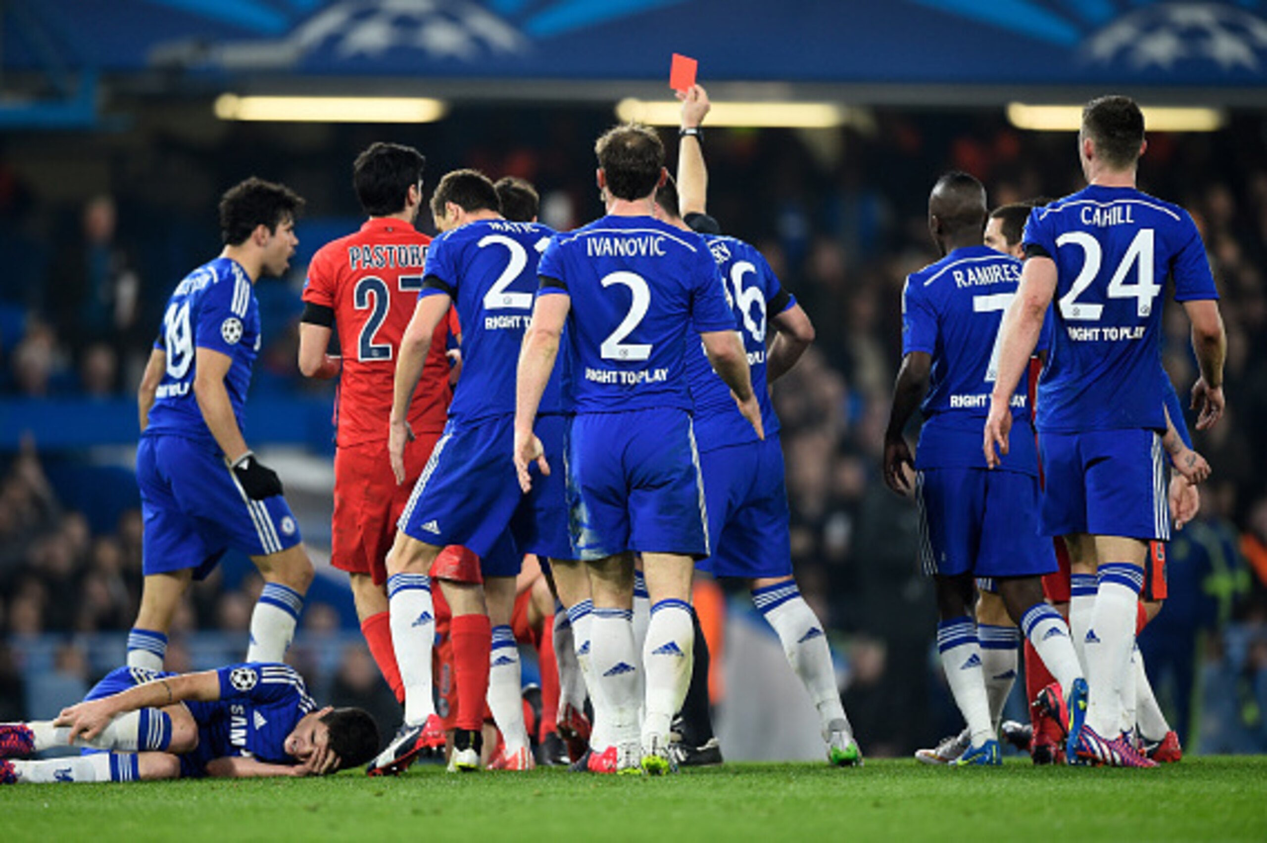LONDON, ENGLAND - MARCH 11:  Referee Bjorn Kuipers of the Netherlands shows a straight red card to Zlatan Ibrahimovic (not seen) of PSG for his tackle on Oscar of Chelsea during the UEFA Champions League Round of 16, second leg match between Chelsea and P