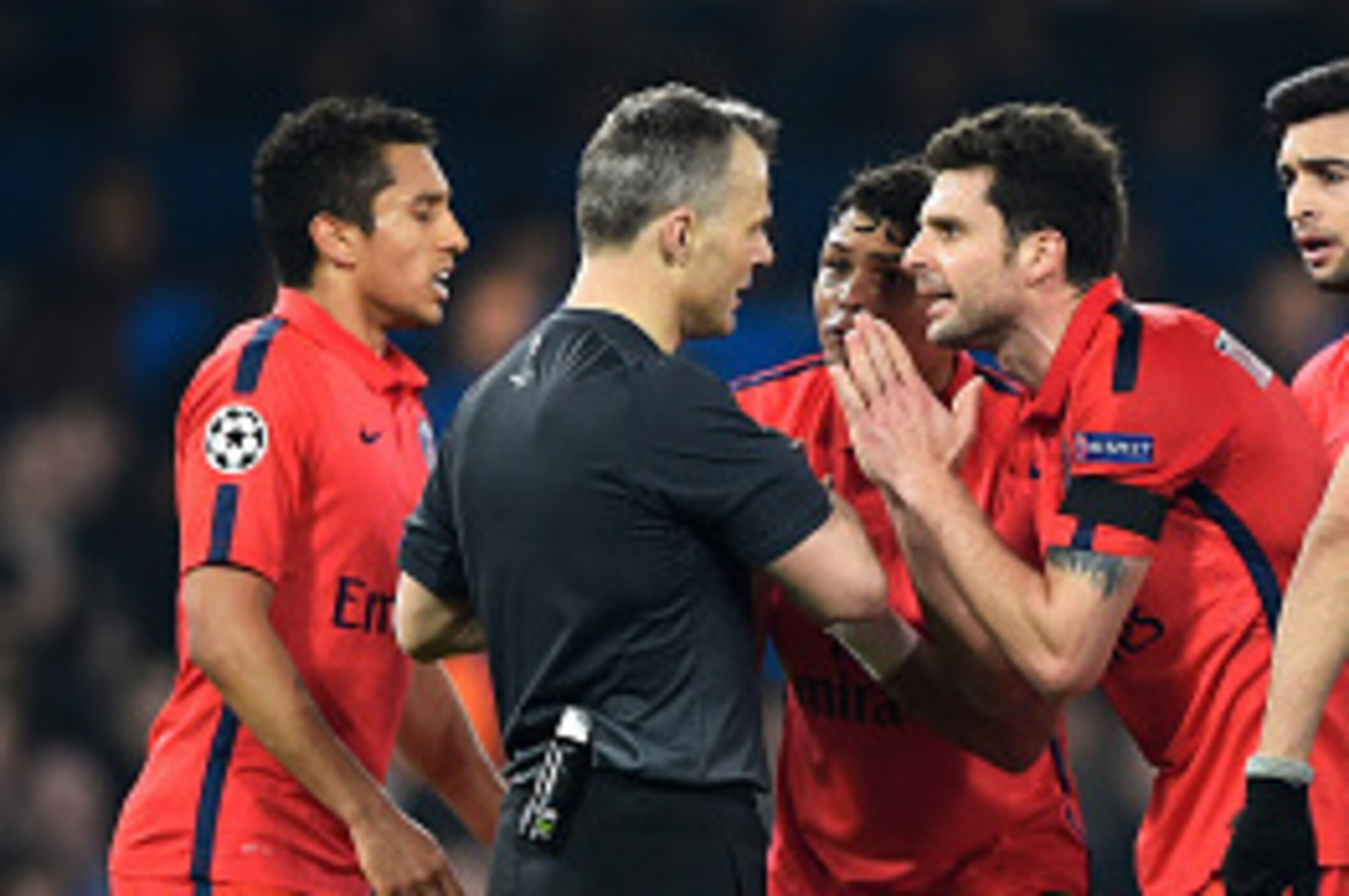 LONDON, ENGLAND - MARCH 11:  Thiago Motta of PSG remonstrates with referee Bjorn Kuipers of the Netherlands not to send off hie teammate Zlatan Ibrahimovic of PSG after a bad tackle on Oscar of Chelsea during the UEFA Champions League Round of 16, second 