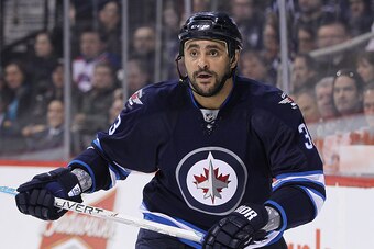 WINNIPEG, MB - MARCH 4: Dustin Byfuglien #33 of the Winnipeg Jets skates down the ice in second period action in an NHL game against the Ottawa Senators at the MTS Centre on March 4, 2015 in Winnipeg, Manitoba, Canada. (Photo by Marianne Helm/Getty Images