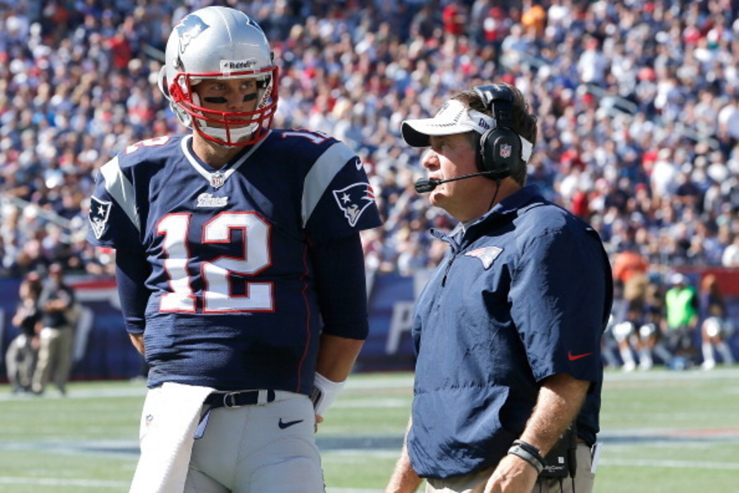 FOXBORO, MA - SEPTEMBER 22: Bill Belichick of the New England Patriots confers with Tom Brady #12 during a time out in the 2nd half in a game with the Tampa Bay Buccaneers at Gillette Stadium on September 22, 2013 in Foxboro, Massachusetts. (Photo by Jim 