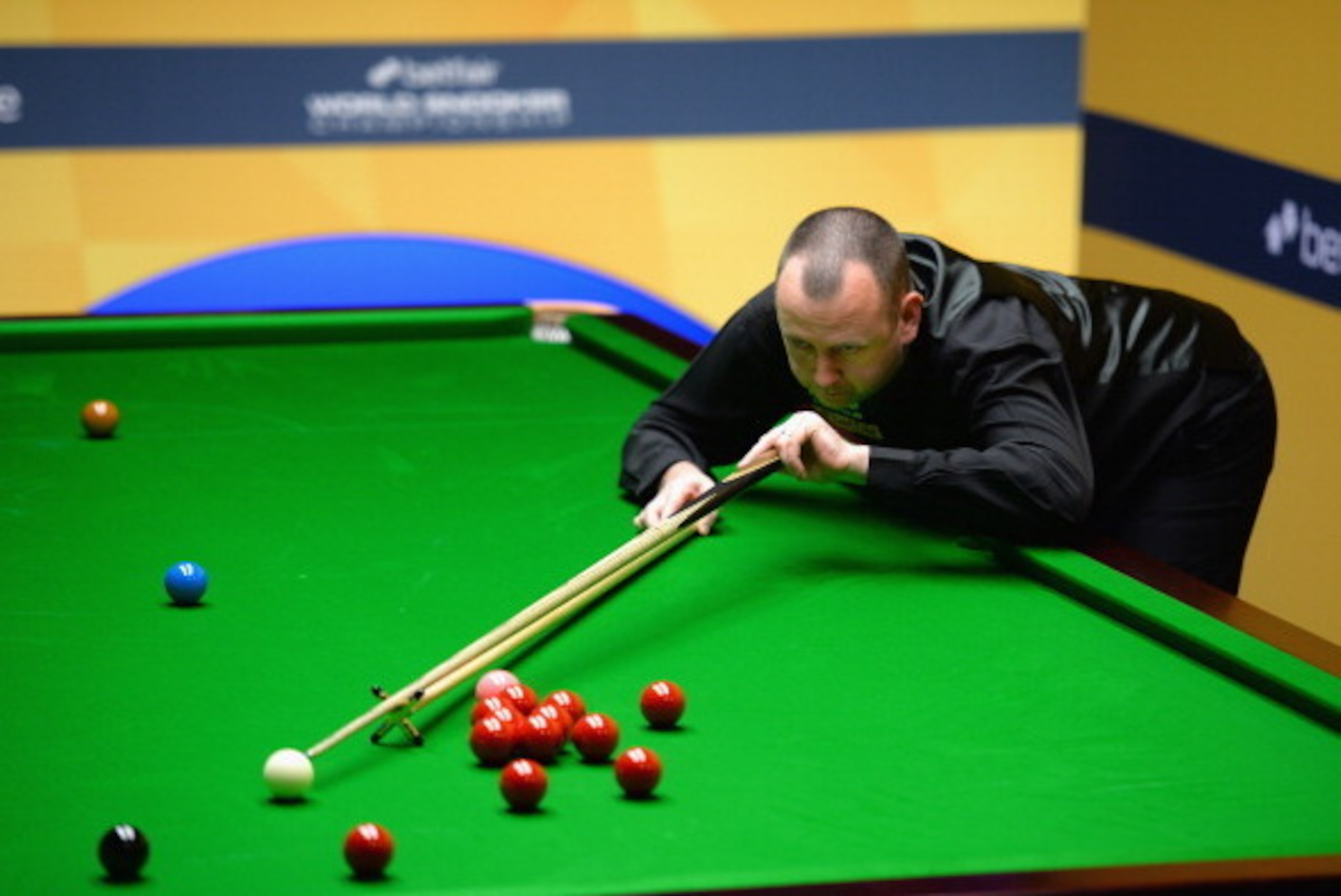 SHEFFIELD, ENGLAND - APRIL 21:  Mark Williams of Wales in action during his first round match against Michael White of Wales during the Betfair World Snooker Championship at the Crucible Theatre on April 21, 2013 in Sheffield, England.  (Photo by Laurence