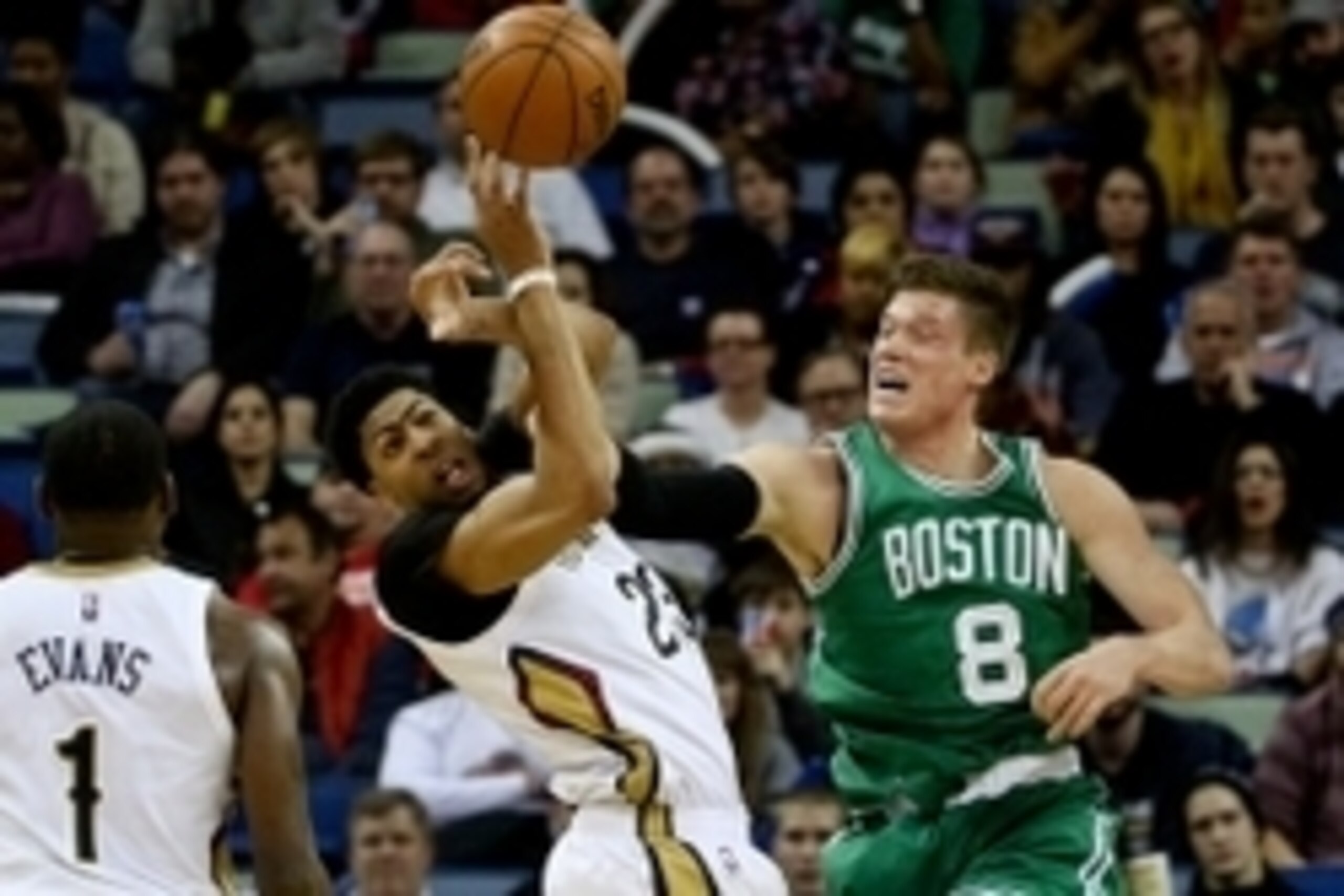 Mar 6, 2015; New Orleans, LA, USA; New Orleans Pelicans forward Anthony Davis (23) and Boston Celtics forward Jonas Jerebko (8) battles for a rebound during the second half at the Smoothie King Center. The Celtics won 104-98. Mandatory Credit: Derick E. H