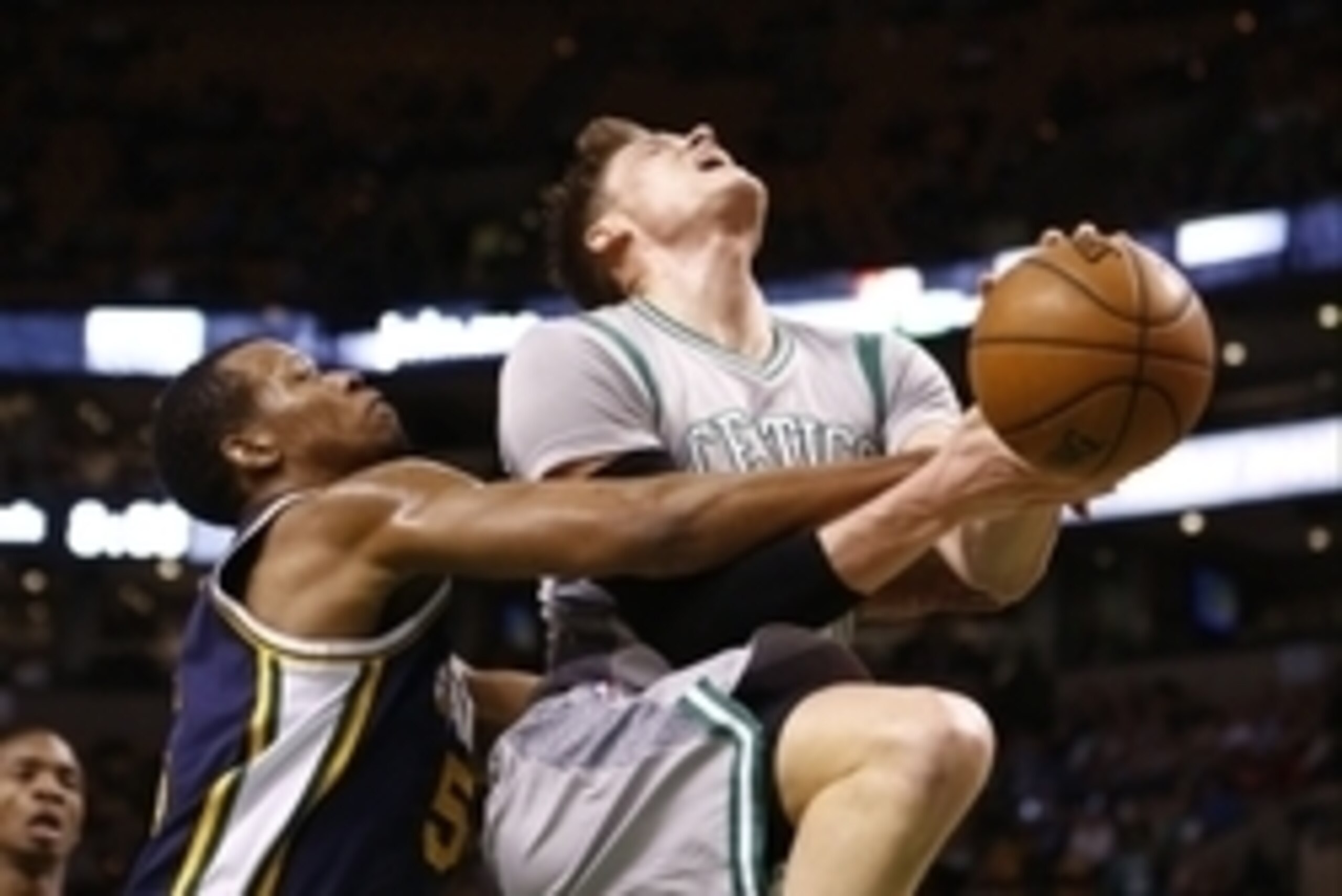 Mar 4, 2015; Boston, MA, USA; Utah Jazz guard Rodney Hood (5) fouls Boston Celtics forward Jonas Jerebko (8) during the first half at TD Garden. Mandatory Credit: Mark L. Baer-USA TODAY Sports
