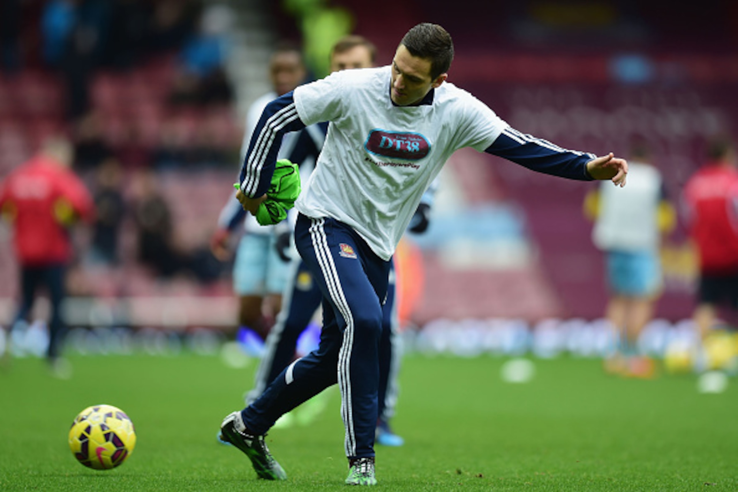 LONDON, ENGLAND - FEBRUARY 28:  Stewart Downing of West Ham United warms up prior to the Barclays Premier League match between West Ham United and Crystal Palace at Boleyn Ground on February 28, 2015 in London, England. Players wear t-shirts in support of