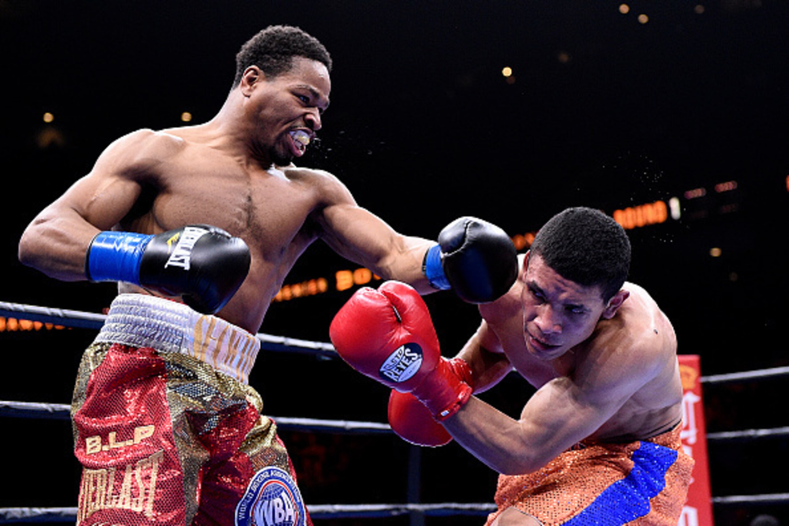 ONTARIO, CA - MARCH 13:  Shawn Porter (L) lands a punch against Erick Bone during their 12 round welterweight bout at Citizens Business Bank Arena March 13, 2015 in Ontario, California. Porter won by knockout in the fifth round. (Photo by Kevork Djansezia