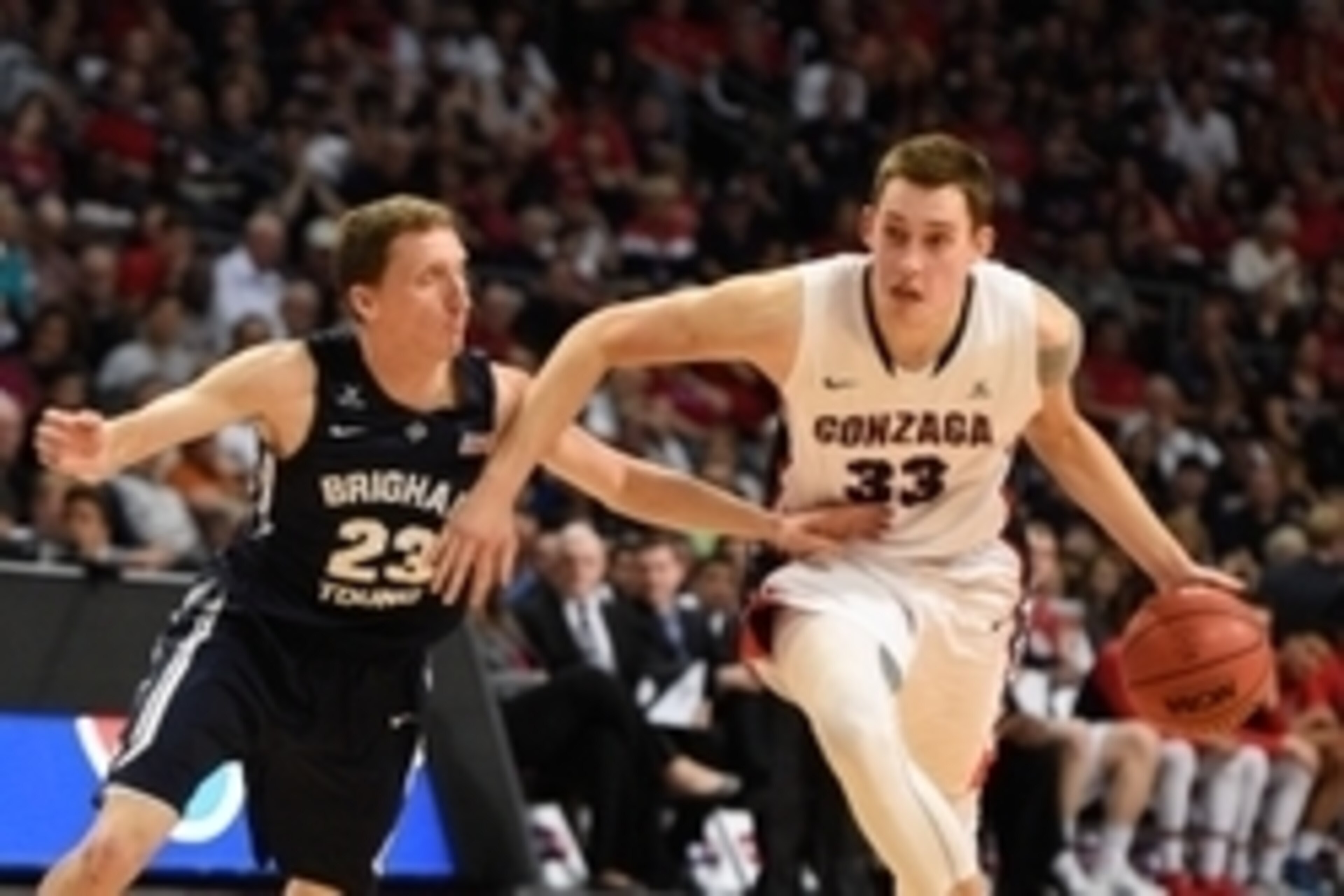 March 10, 2015; Las Vegas, NV, USA; Gonzaga Bulldogs forward Kyle Wiltjer (33) dribbles the basketball against Brigham Young Cougars guard Skyler Halford (23) during the first half in the finals of the West Coast Conference tournament at Orleans Arena. Ma
