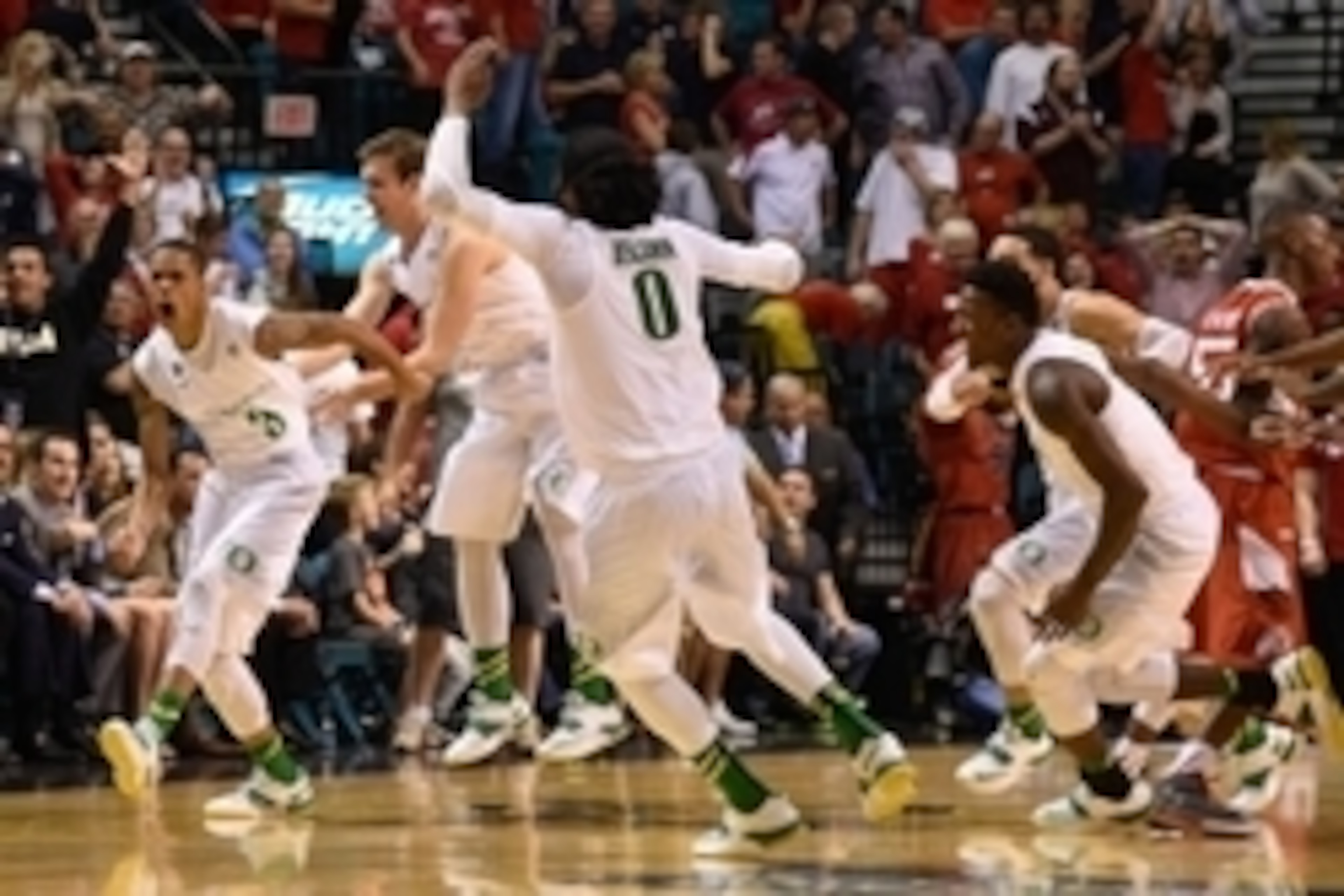 March 13, 2015; Las Vegas, NV, USA; Oregon Ducks guard Joseph Young (3) is congratulated after making the game-winning three-point basket against the Utah Utes after the game in the semifinal round of the Pac-12 Conference tournament at MGM Grand Garden A
