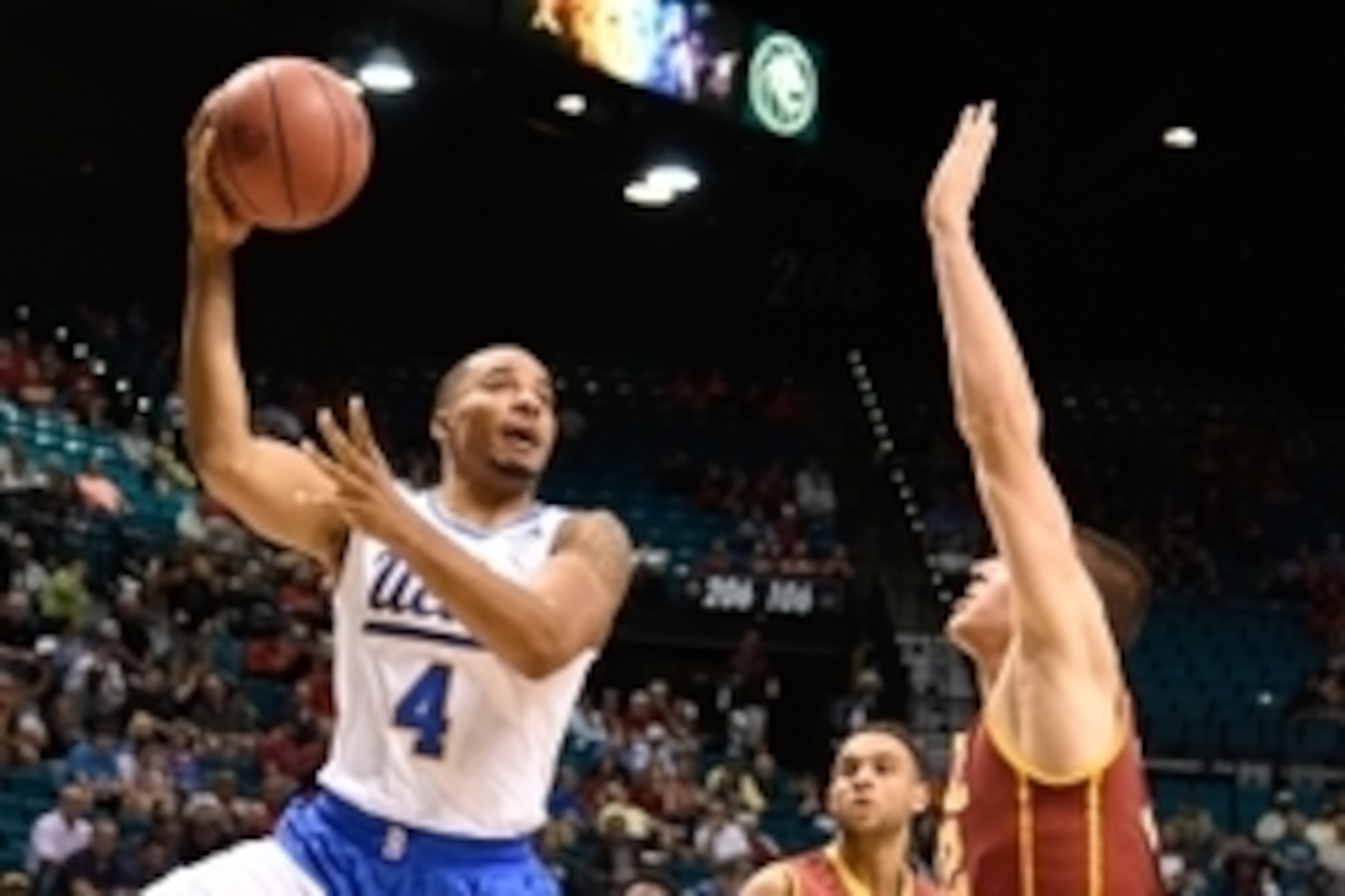 March 12, 2015; Las Vegas, NV, USA; UCLA Bruins guard Norman Powell (4) shoots the basketball against Southern California Trojans forward Nikola Jovanovic (32) during the second half in the quarterfinal round of the Pac-12 Conference tournament at MGM Gra
