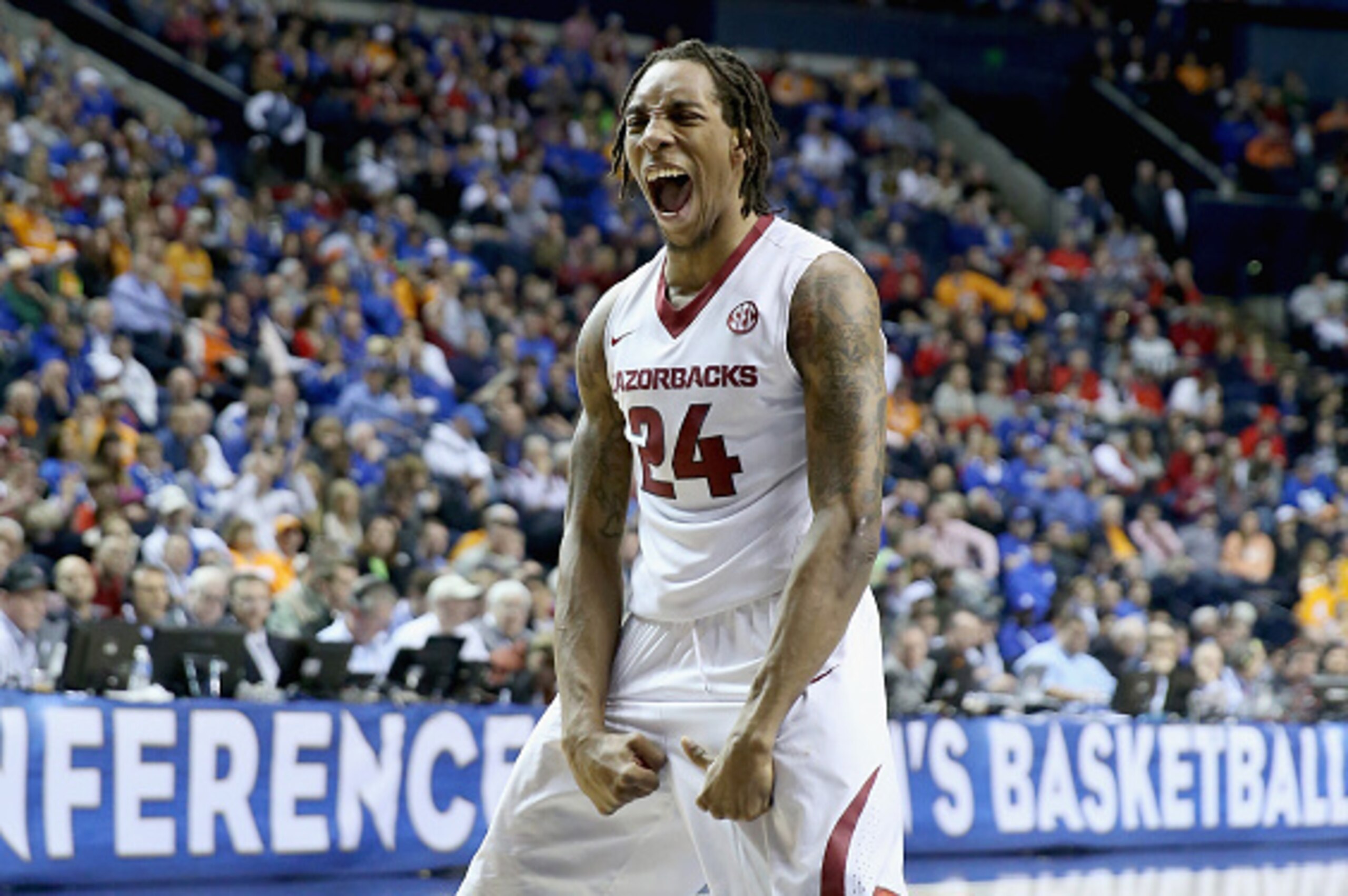 NASHVILLE, TN - MARCH 13:  Michael Qualls #24 of the Arkansas Razorbacks celebrates in the game against the Tennessee Volunteers during the quaterfinals of the SEC Basketball Tournament at Bridgestone Arena on March 13, 2015 in Nashville, Tennessee.  (Pho
