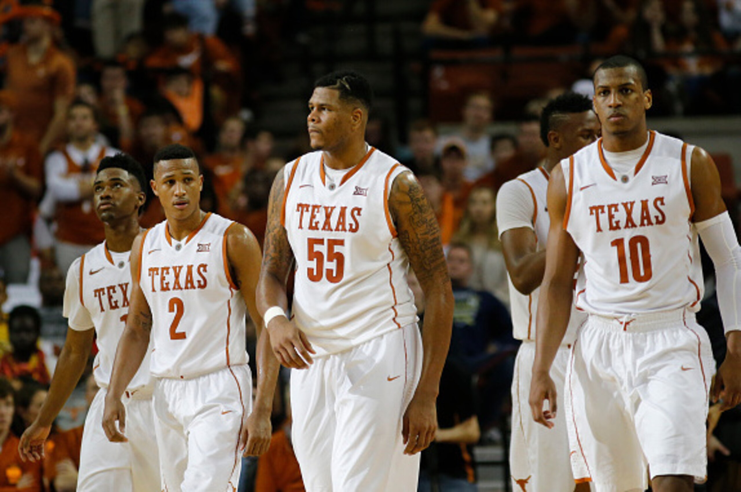 AUSTIN, TX - JANUARY 24: (Left to right) Isaiah Taylor #1, Demarcus Holland #2, Cameron Ridley #55 and Jonathan Holmes #10 of the Texas Longhorns walk on the court during the game with the Kansas Jayhawks at the Frank Erwin Center on January 24, 2015 in A