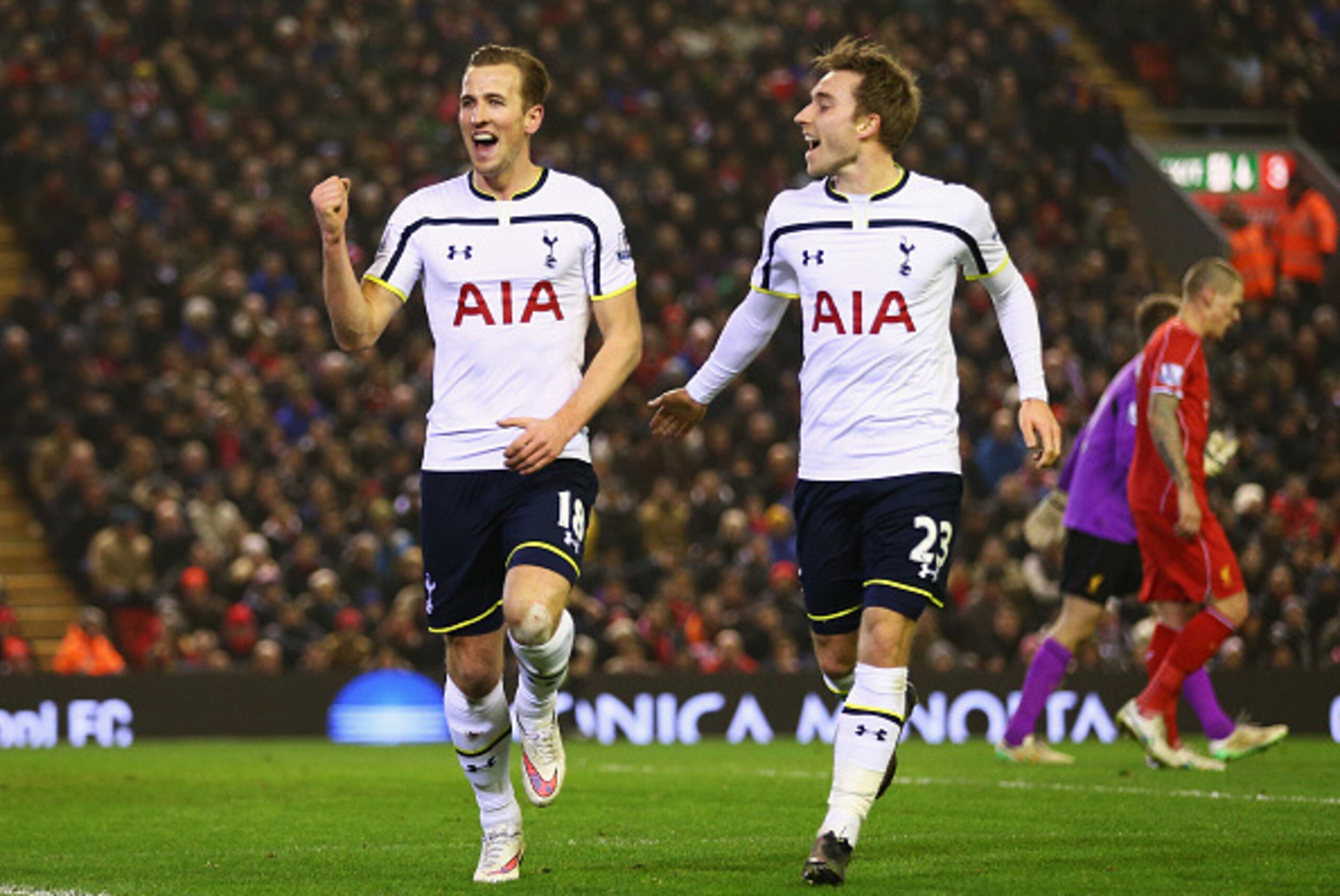 LIVERPOOL, ENGLAND - FEBRUARY 10:  Harry Kane of Tottenham Hotspur celebrates scoring his goal with Christian Eriksen during the Barclays Premier League match between Liverpool and Tottenham Hotspur at Anfield on February 10, 2015 in Liverpool, England.  
