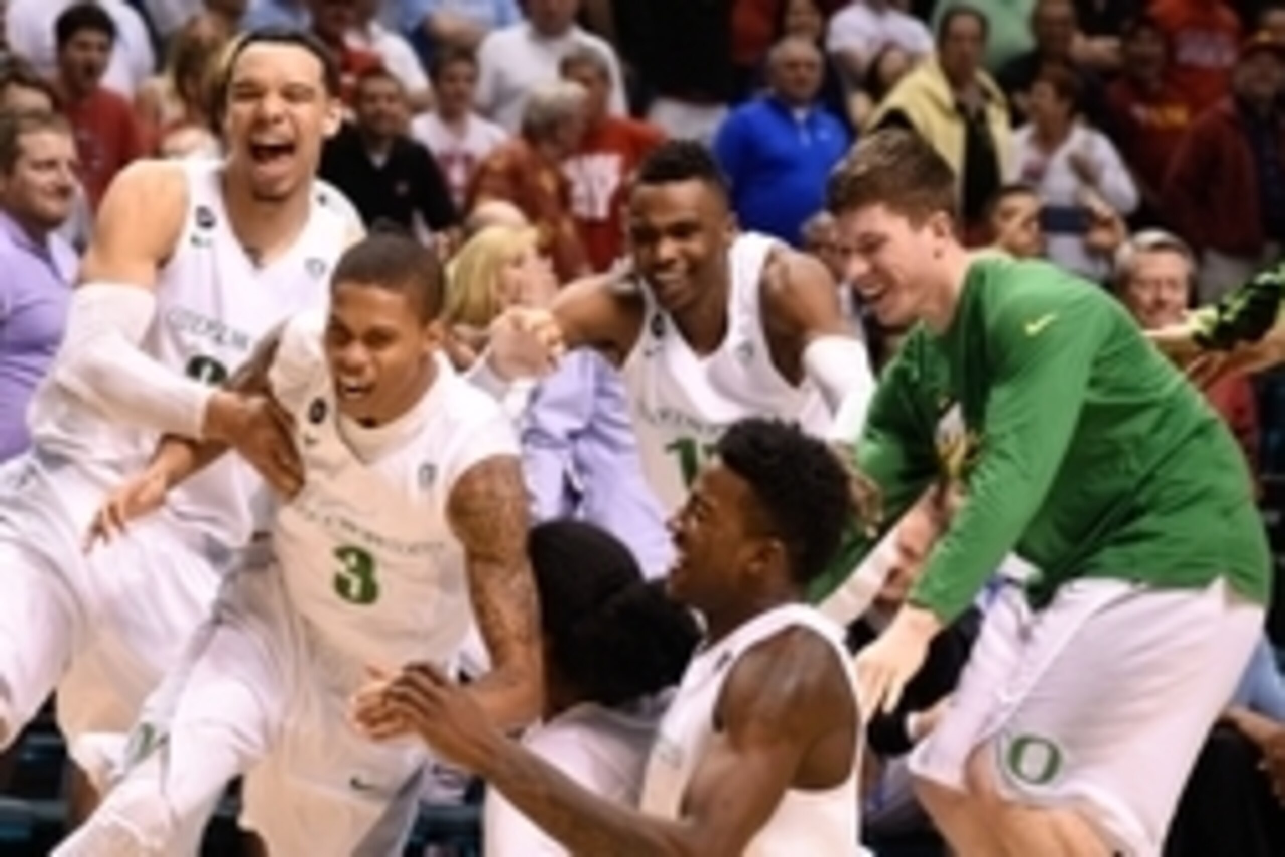 March 13, 2015; Las Vegas, NV, USA; Oregon Ducks guard Joseph Young (3) is congratulated after making the game-winning three-point basket against the Utah Utes after the game in the semifinal round of the Pac-12 Conference tournament at MGM Grand Garden A