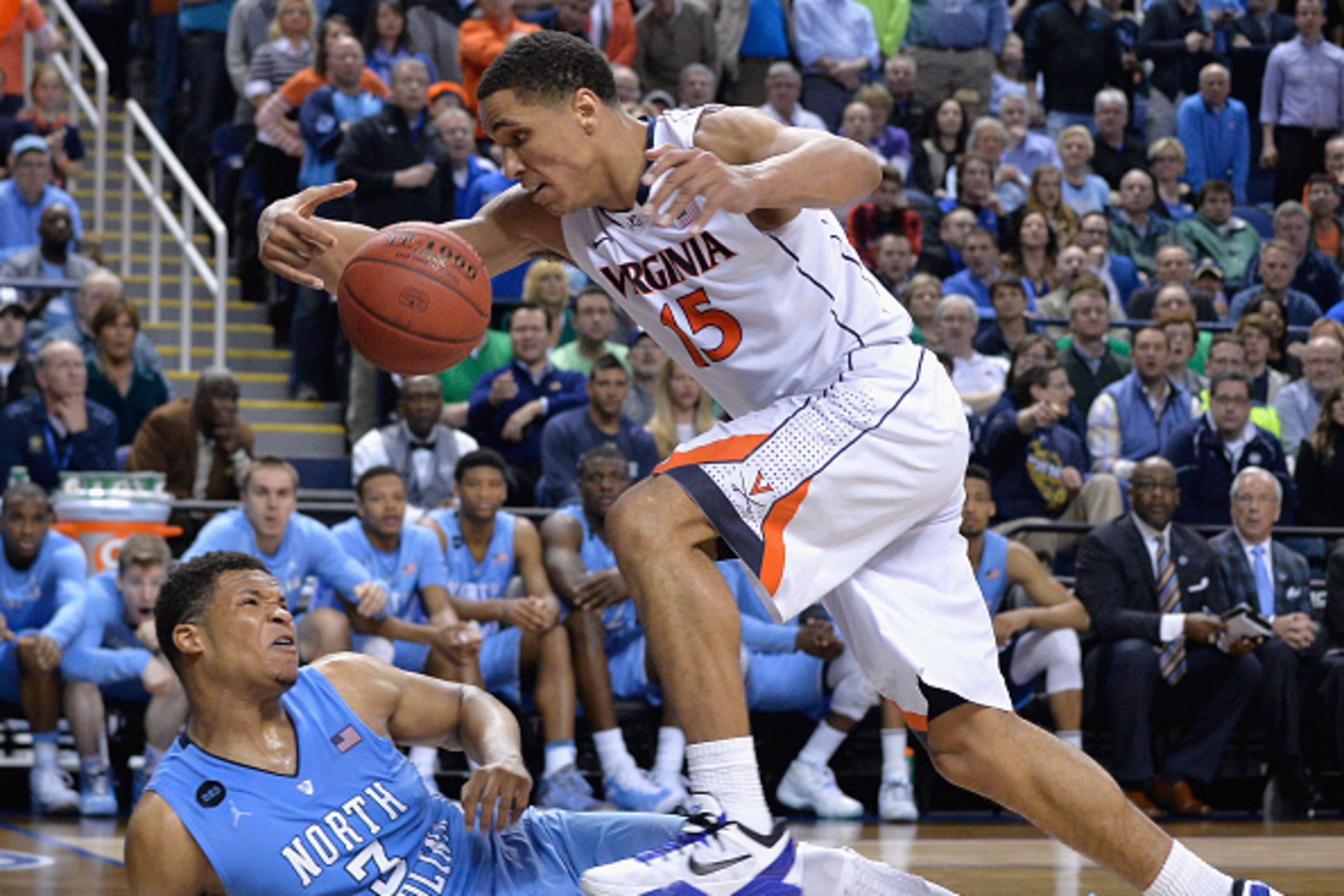GREENSBORO, NC - MARCH 13: Malcolm Brogdon #15 of the Virginia Cavaliers and Kennedy Meeks #3 of the North Carolina Tar Heels go after a loose ball during the semifinals of the 2015 ACC Basketball Tournament at Greensboro Coliseum on March 13, 2015 in Gr GREENSBORO, NC - MARCH 13: Malcolm Brogdon #15 of the Virginia Cavaliers and Kennedy Meeks #3 of the North Carolina Tar Heels go after a loose ball during the semifinals of the 2015 ACC Basketball Tournament at Greensboro Coliseum on March 13, 2015 in Gr
