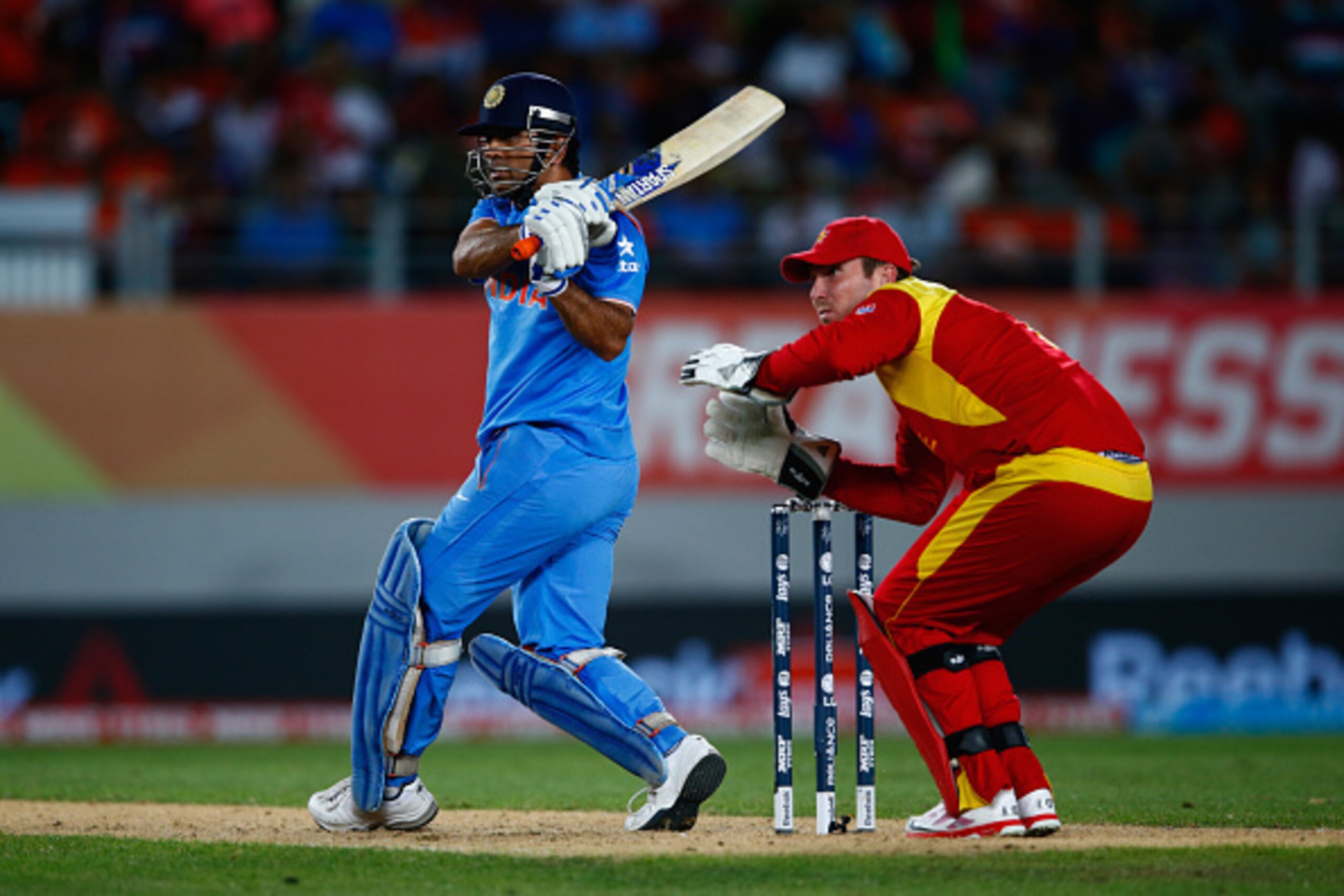 AUCKLAND, NEW ZEALAND - MARCH 14:  MS Dhoni of India bats during the 2015 ICC Cricket World Cup match between India and Zimbabwe at Eden Park on March 14, 2015 in Auckland, New Zealand.  (Photo by Phil Walter/Getty Images)