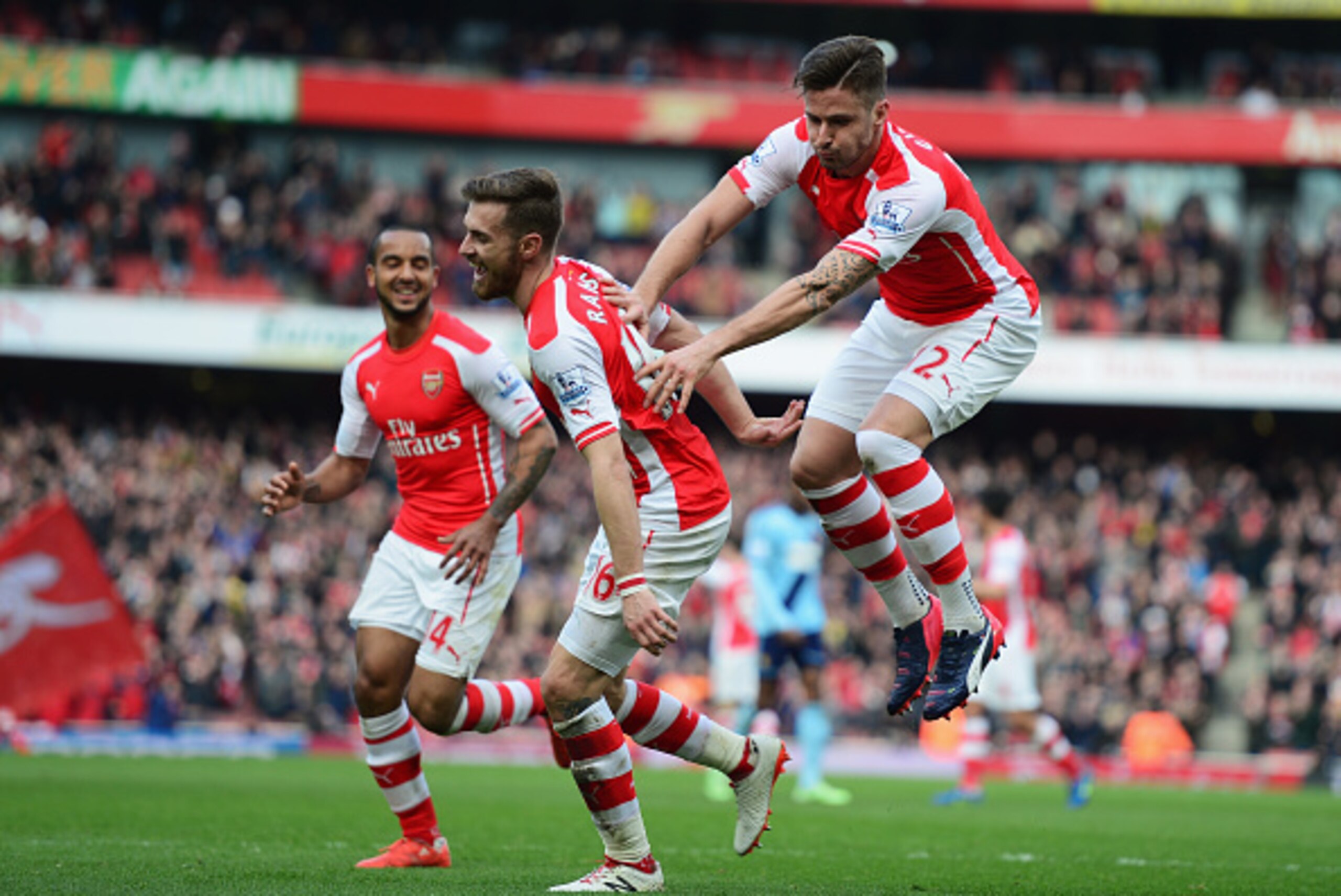LONDON, ENGLAND - MARCH 14: Olivier Giroud (R) of Arsenal celebrates scoring the opening goal with Theo Walcott (L) and Aaron Ramsey during the Barclays Premier League match between Arsenal and West Ham United at Emirates Stadium on March 14, 2015 in Lon LONDON, ENGLAND - MARCH 14: Olivier Giroud (R) of Arsenal celebrates scoring the opening goal with Theo Walcott (L) and Aaron Ramsey during the Barclays Premier League match between Arsenal and West Ham United at Emirates Stadium on March 14, 2015 in Lon