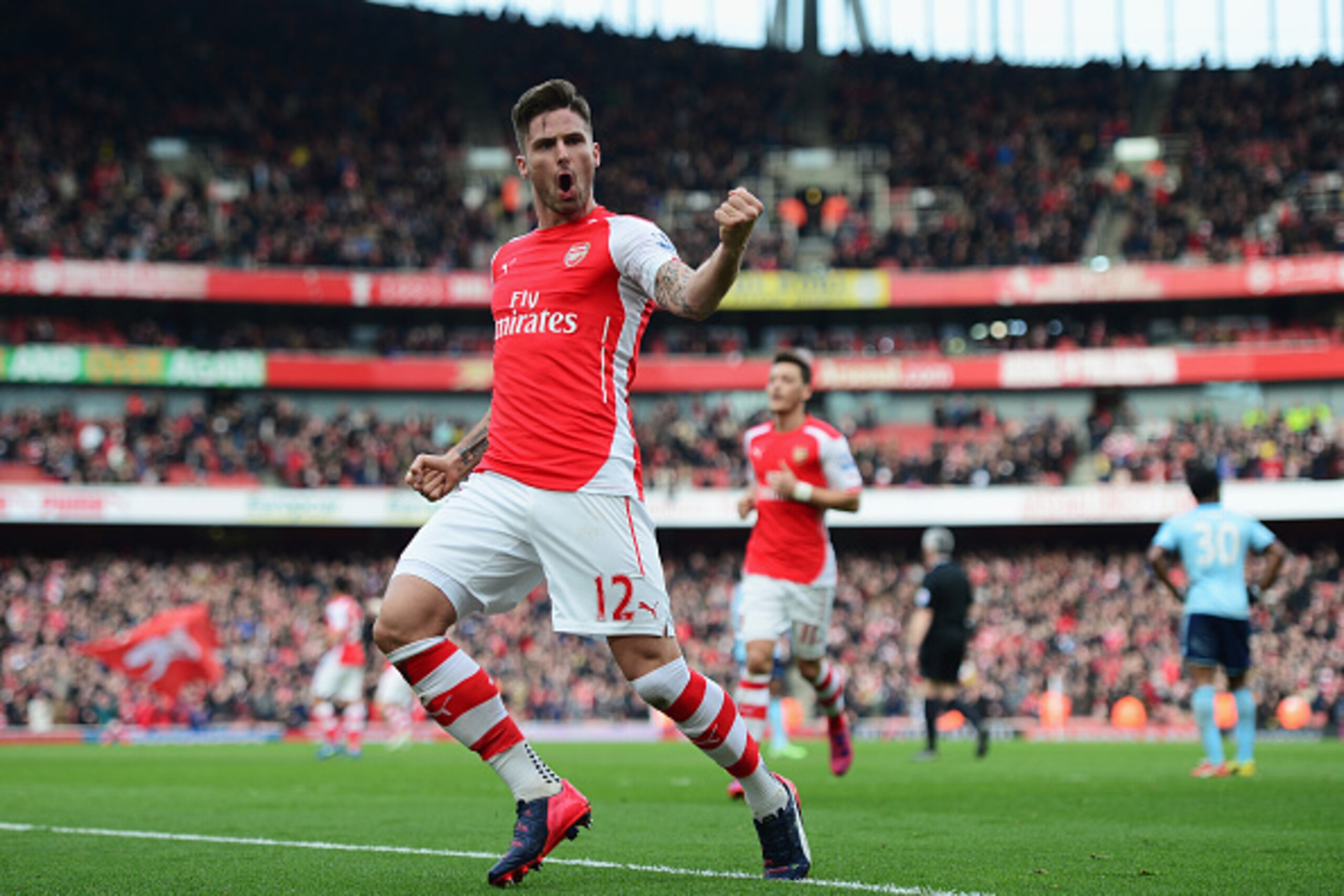 LONDON, ENGLAND - MARCH 14:  Olivier Giroud of Arsenal celebrates scoring the opening goal during the Barclays Premier League match between Arsenal and West Ham United at Emirates Stadium on March 14, 2015 in London, England.  (Photo by Jamie McDonald/Get