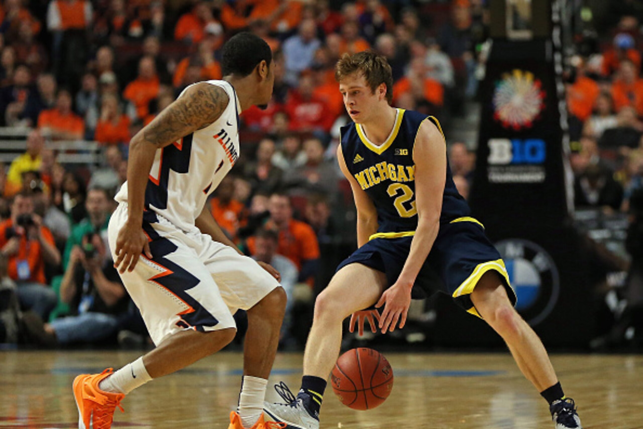 CHICAGO, IL - MARCH 12: Spike Albrecht #2 of the Michigan Wolverines moves against Jaylon Tate #1 of the Illinois Fighting Illini during the second round of the 2015 Big Ten Men's Basketball Tournament at the United Center on March 12, 2015 in Chicago, Il