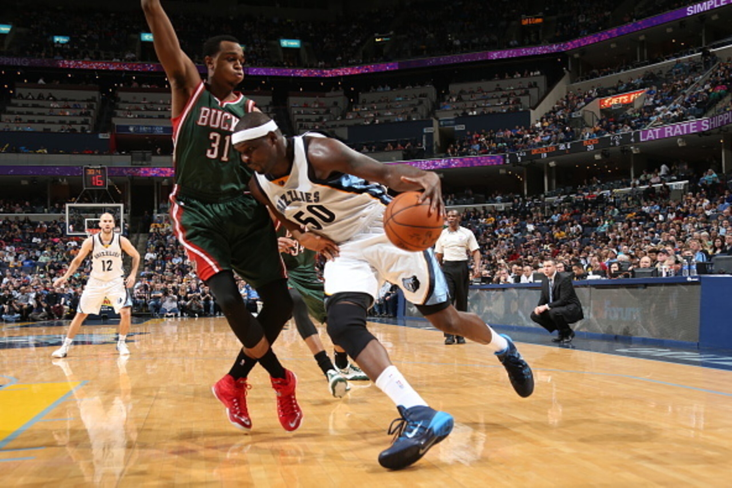 MEMPHIS, TN - MARCH 14:  Zach Randolph #50 of the Memphis Grizzlies drives to the basket against John Henson #31 of the Milwaukee Bucks on March 14, 2015 at FedExForum in Memphis, Tennessee. NOTE TO USER: User expressly acknowledges and agrees that, by do