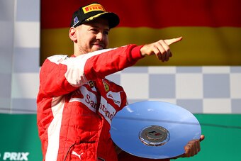 MELBOURNE, AUSTRALIA - MARCH 15:  Sebastian Vettel of Germany and Ferrari celebrates on the podium after finishing third in the Australian Formula One Grand Prix at Albert Park on March 15, 2015 in Melbourne, Australia.  (Photo by Dan Istitene/Getty Image