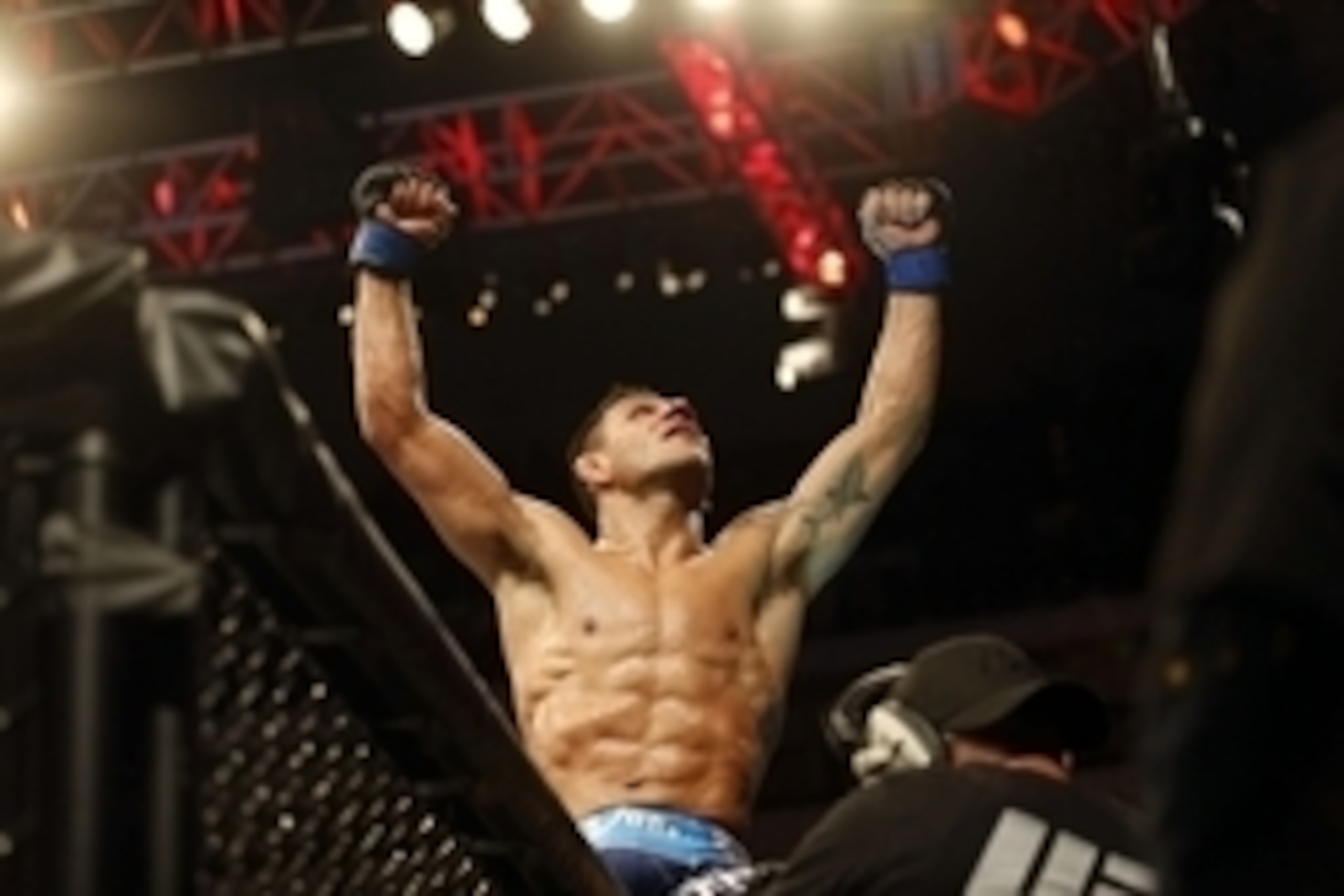 Mar 14, 2015; Dallas, TX, USA;  Rafael dos Anjos (blue) reacts after defeating Anthony Pettis (red) in the lightweight title bout during UFC 185 at American Airlines Center. Mandatory Credit: Tim Heitman-USA TODAY Sports