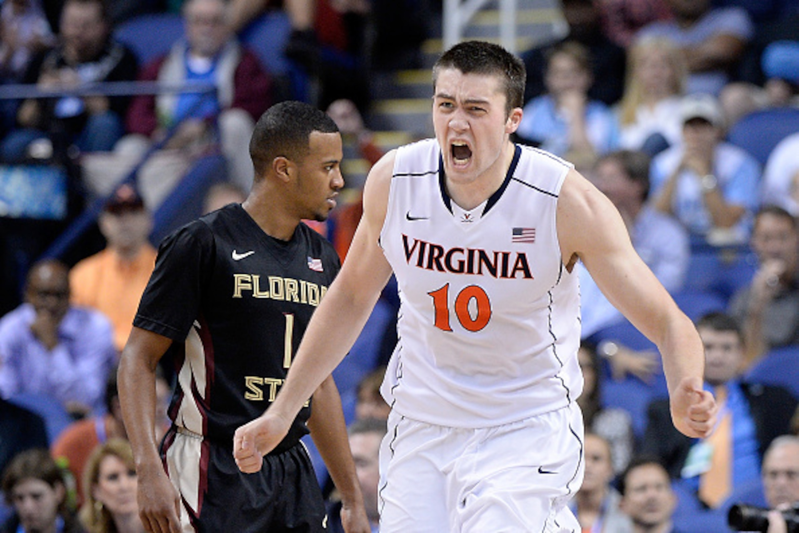 GREENSBORO, NC - MARCH 12:  Mike Tobey #10 of the Virginia Cavaliers reacts after dunking against the Florida State Seminoles during the quarterfinals of the ACC Basketball Tournament at Greensboro Coliseum on March 12, 2015 in Greensboro, North Carolina.