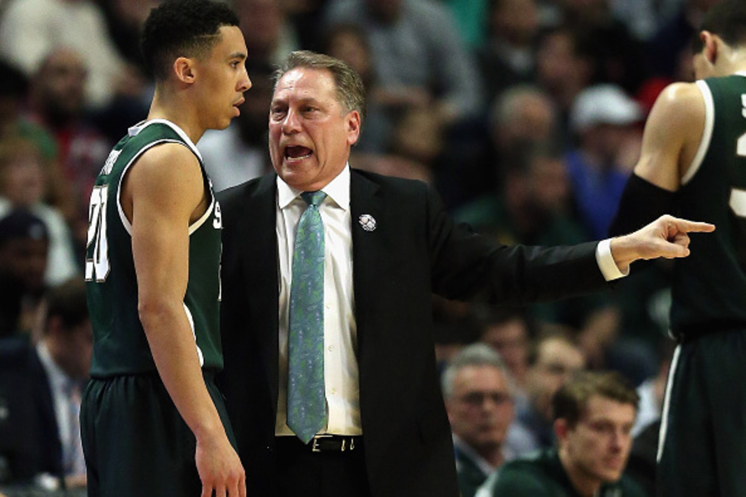 CHICAGO, IL - MARCH 15: Head coach Tom Izzo of the Michigan State Spartans gives instructions to Travis Trice #20 as they take on the Wisconsin Badgers during the Championship game of the 2015 Big Ten Men's Basketball Tournament at the United Center on Ma
