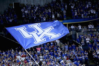 NASHVILLE, TN - MARCH 15:  A Kentucky Wildcats flag flies is waved before the game against the Arkansas Razorbacks in the championship game of the SEC Basketball Tournament at Bridgestone Arena on March 15, 2015 in Nashville, Tennessee.  (Photo by Andy Ly