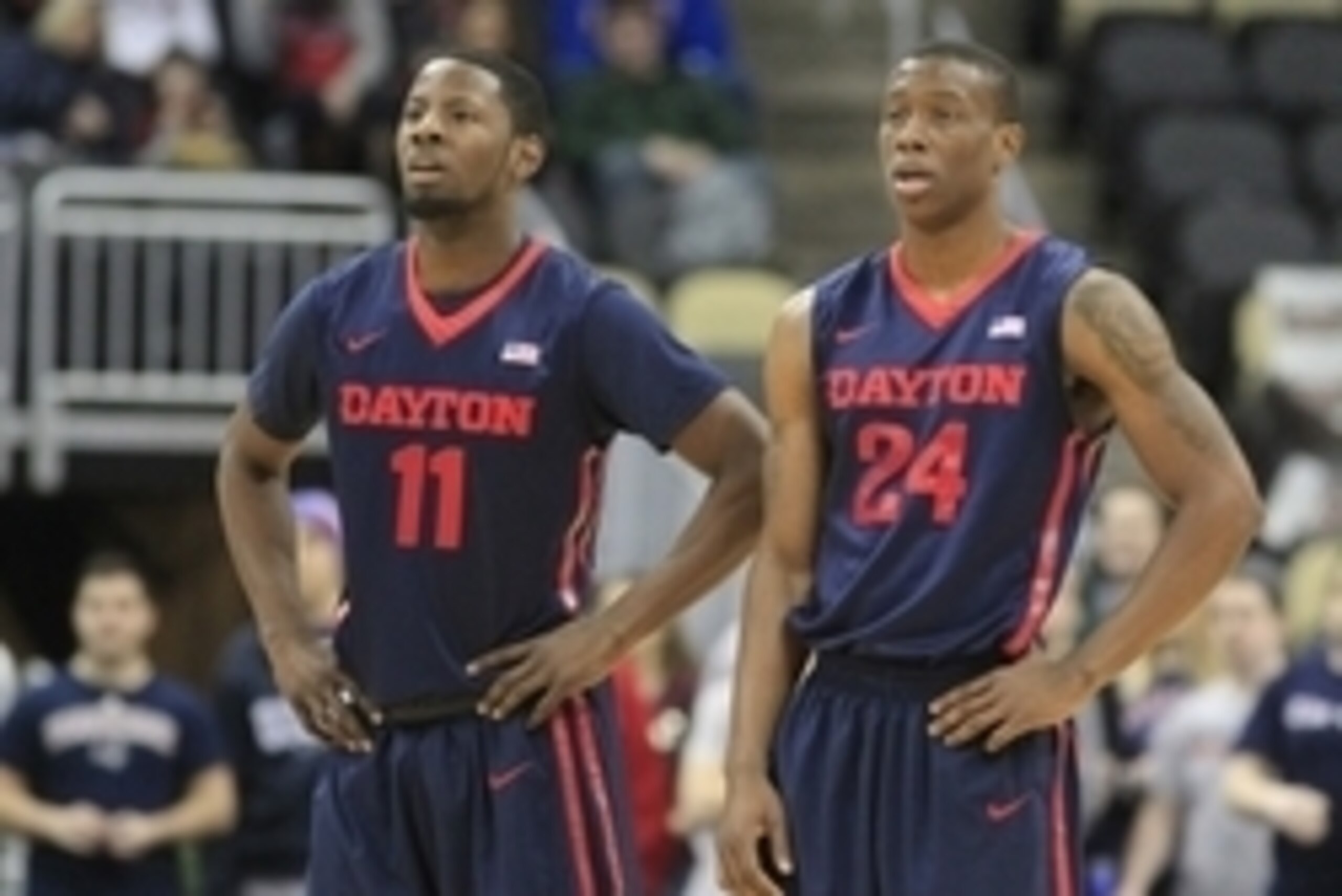 Feb 21, 2015; Pittsburgh, PA, USA; Dayton Flyers guards Scoochie Smith (11) and Jordan Sibert (24) look on against the Duquesne Dukes during the first half at the CONSOL Energy Center. Duquesne won 83-73. Mandatory Credit: Charles LeClaire-USA TODAY Sport