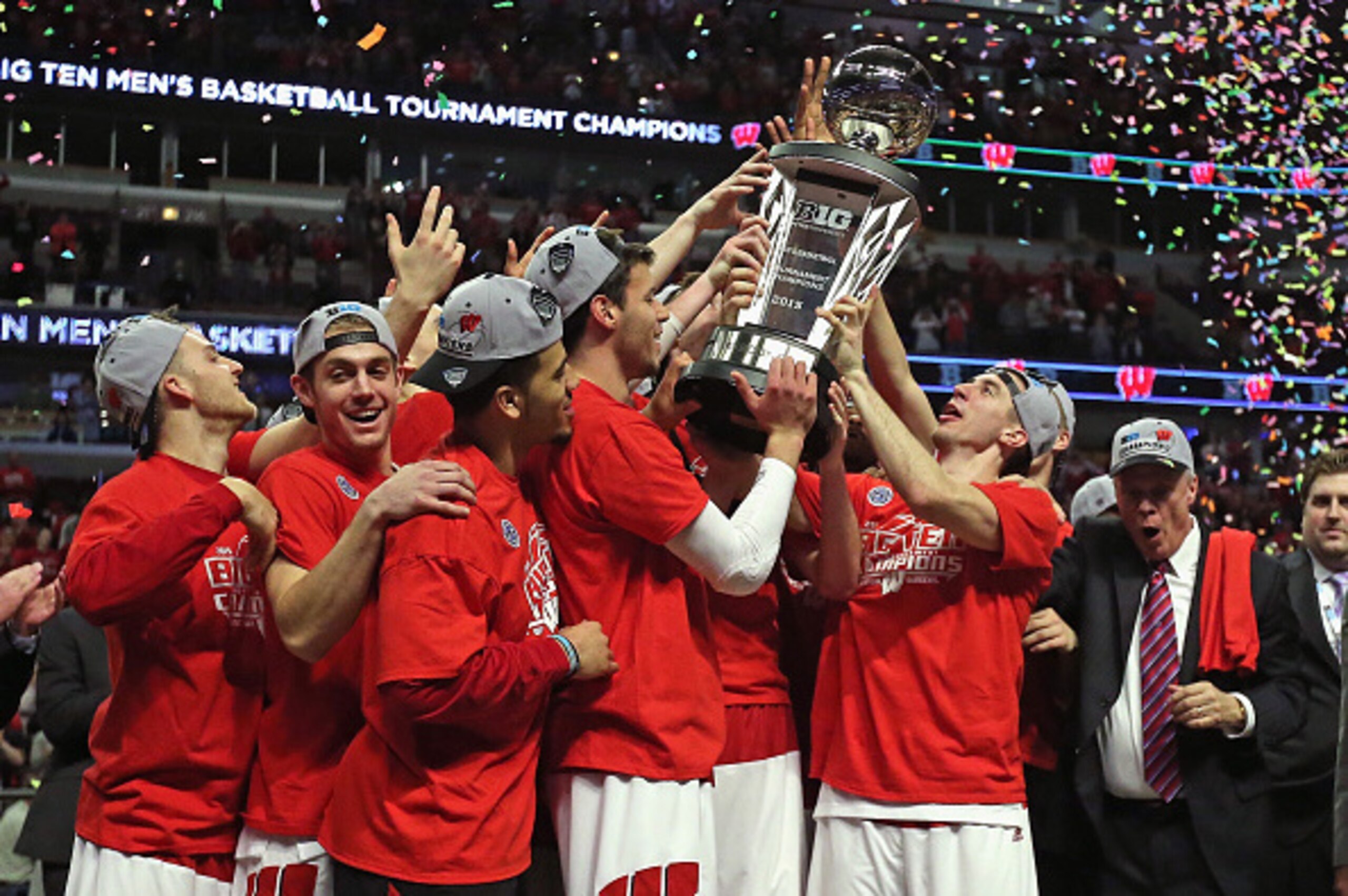 CHICAGO, IL - MARCH 15: Members of the Wisconsin Badgers hoist the Big Ten trophy after winning the Championship game of the 2015 Big Ten Men's Basketball Tournament against the Michigan State Spartans at the United Center on March 15, 2015 in Chicago, Il