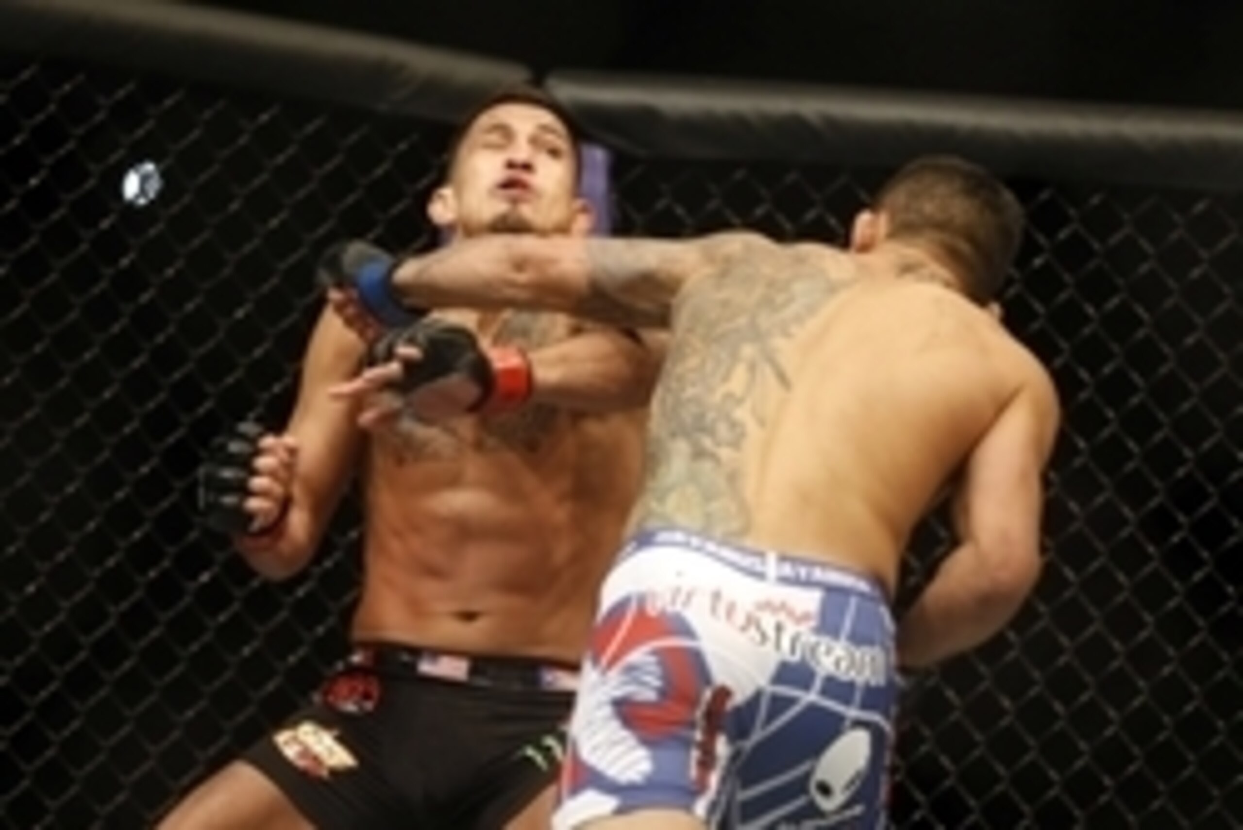 Mar 14, 2015; Dallas, TX, USA; Anthony Pettis (red) fights Rafael dos Anjos (blue) in the lightweight title bout during UFC 185 at American Airlines Center. Mandatory Credit: Tim Heitman-USA TODAY Sports