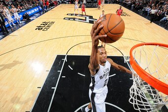 SAN ANTONIO, TX - MARCH 8:  Kawhi Leonard #2 of the San Antonio Spurs dunks the ball against the Chicago Bulls during the game on March 8, 2015 at AT&T Center in San Antonio, Texas. NOTE TO USER: User expressly acknowledges and agrees that, by downloading