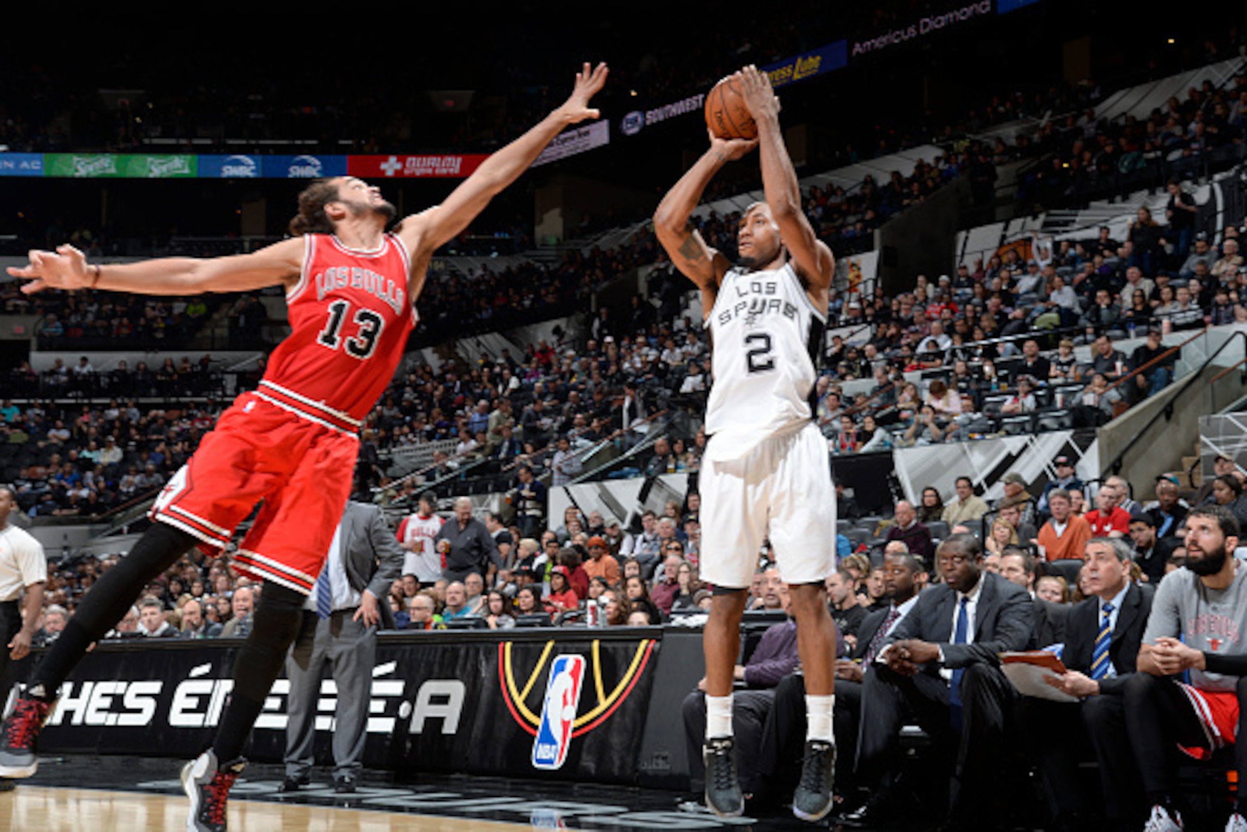 SAN ANTONIO, TX - MARCH 8: Kawhi Leonard #2 of the San Antonio Spurs shoots against Joakim Noah #13 of the Chicago Bulls during the game on March 8, 2015 at AT&T Center in San Antonio, Texas. NOTE TO USER: User expressly acknowledges and agrees that, by d SAN ANTONIO, TX - MARCH 8: Kawhi Leonard #2 of the San Antonio Spurs shoots against Joakim Noah #13 of the Chicago Bulls during the game on March 8, 2015 at AT&T Center in San Antonio, Texas. NOTE TO USER: User expressly acknowledges and agrees that, by d