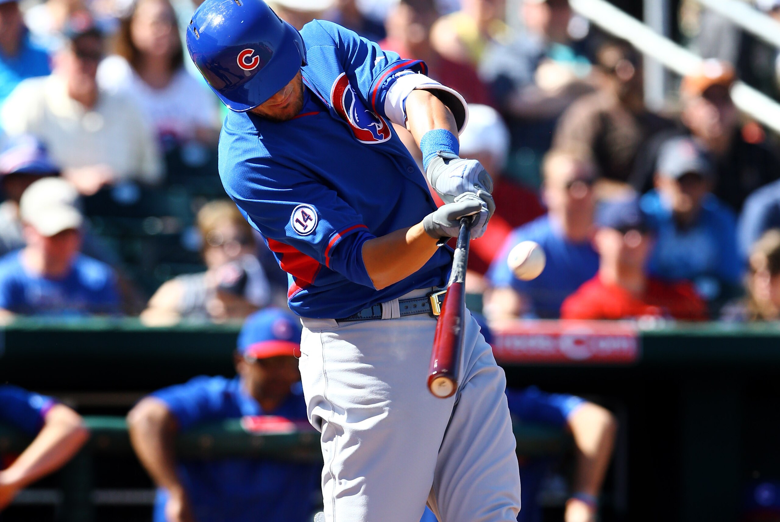 Mar 10, 2015; Goodyear, AZ, USA; Chicago Cubs third baseman Kris Bryant hits a fourth inning home run against the Cleveland Indians during a spring training baseball game at Goodyear Ballpark. Mandatory Credit: Mark J. Rebilas-USA TODAY Sports