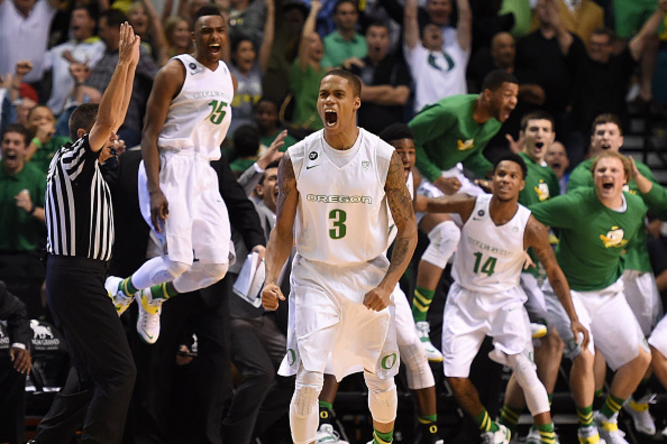 LAS VEGAS, NV - MARCH 13:  Joseph Young #3 of the Oregon Ducks reacts in front of his bench after he hit a game-winning 3-pointer in a semifinal game of the Pac-12 Basketball Tournament against the Utah Utes at the MGM Grand Garden Arena on March 13, 2015