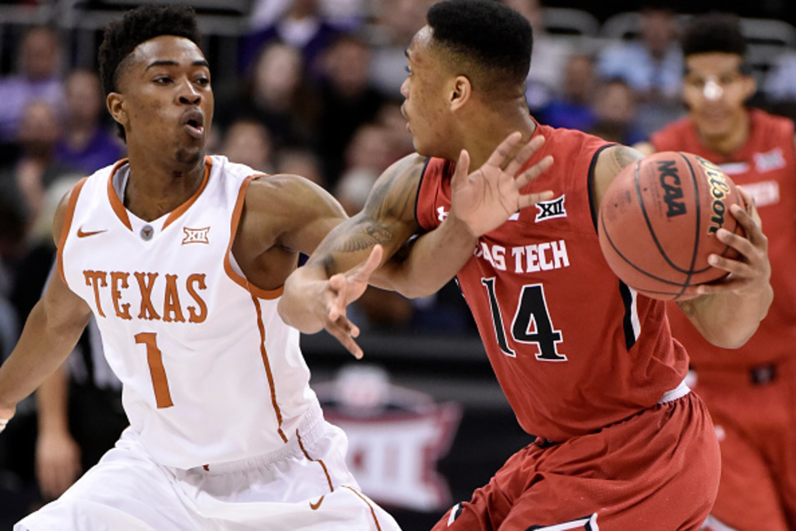 KANSAS CITY, MO - MARCH 11: Isaiah Taylor #1 of the Texas Longhorns defends against Robert Turner #14 of the Texas Tech Red Raiders as he looks to pass the ball during the first round of the Big 12 basketball tournament at Sprint Center on March 11, 2015 KANSAS CITY, MO - MARCH 11: Isaiah Taylor #1 of the Texas Longhorns defends against Robert Turner #14 of the Texas Tech Red Raiders as he looks to pass the ball during the first round of the Big 12 basketball tournament at Sprint Center on March 11, 2015