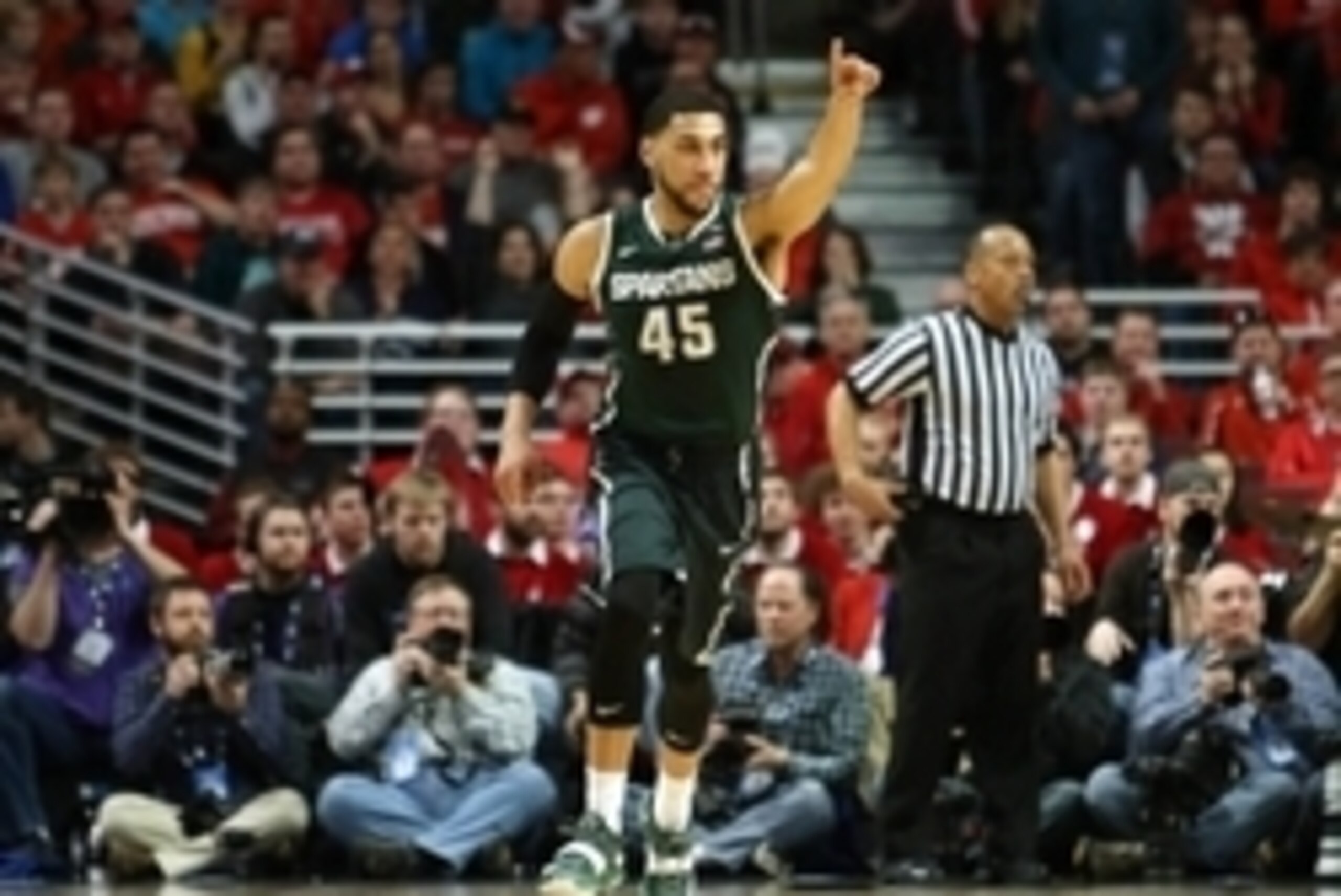 Mar 15, 2015; Chicago, IL, USA; Michigan State Spartans guard Denzel Valentine (45) reacts after a made basket against the Wisconsin Badgers during the first half in the championship game of the Big Ten Tournament at United Center. Mandatory Credit: Caylo
