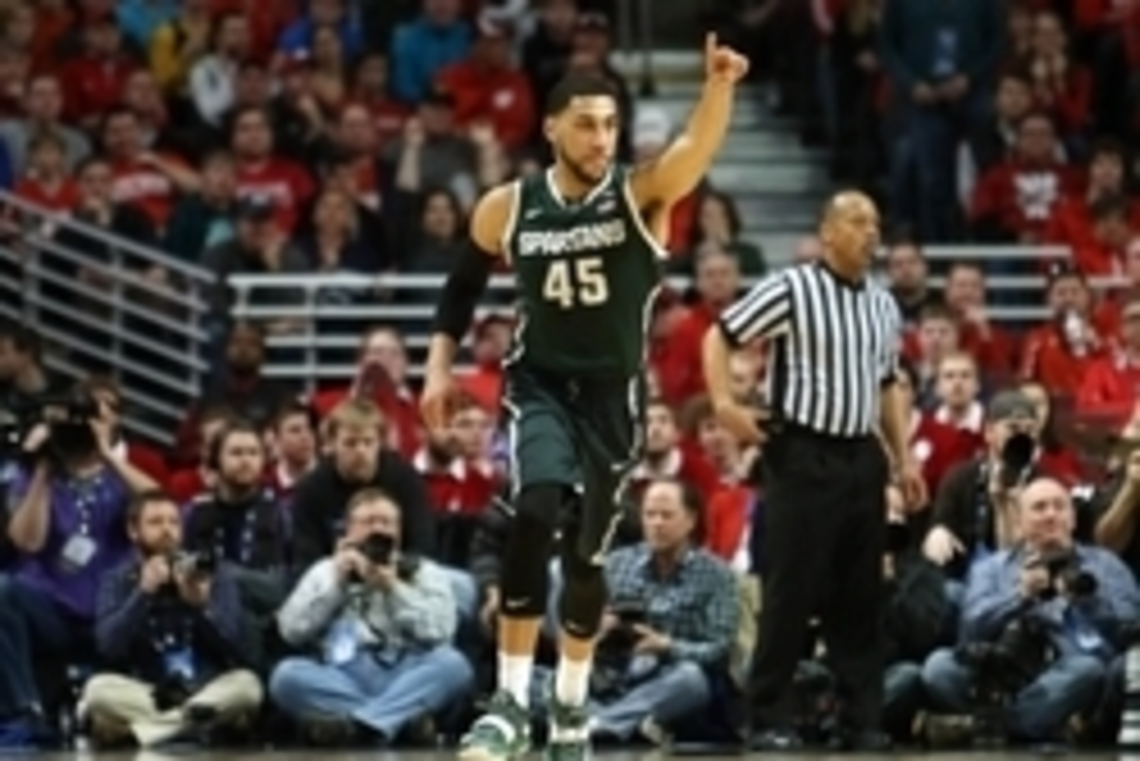 Mar 15, 2015; Chicago, IL, USA; Michigan State Spartans guard Denzel Valentine (45) reacts after a made basket against the Wisconsin Badgers during the first half in the championship game of the Big Ten Tournament at United Center. Mandatory Credit: Caylo