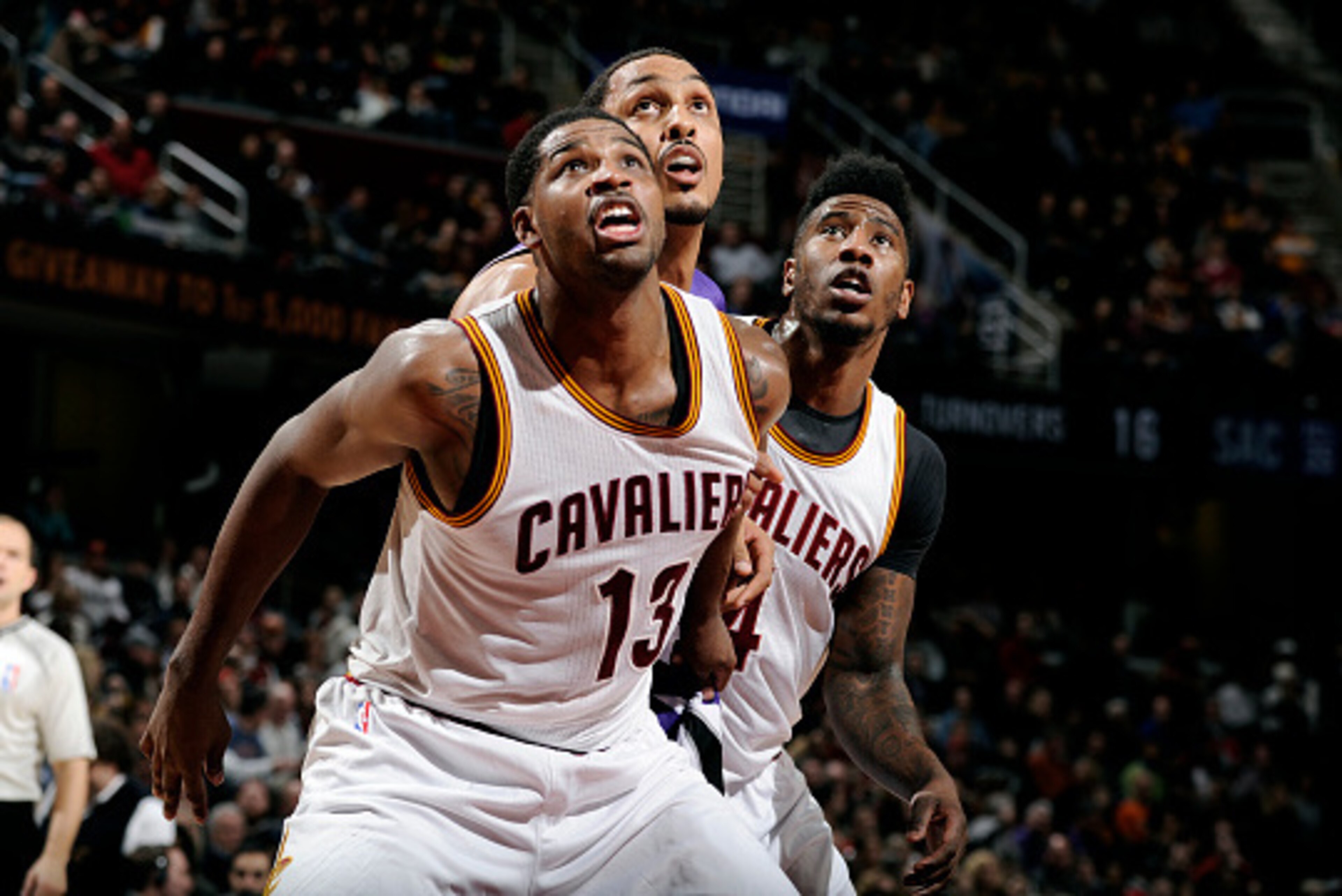 CLEVELAND, OH - JANUARY 30: Tristan Thompson #13 and Iman Shumpert #4 of the Cleveland Cavaliers battle for position against Ryan Hollins #5 of the Sacramento Kings at The Quicken Loans Arena on January 30, 2015 in Cleveland, Ohio. NOTE TO USER: User expr