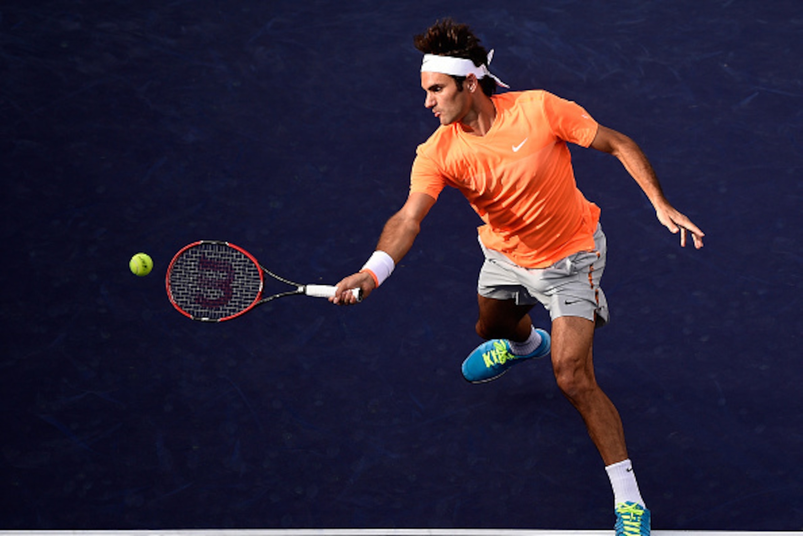 INDIAN WELLS, CA - MARCH 15:  Roger Federer of Switzerland volleys in his match against Diego Schwartzman of Argentina during the BNP Parisbas Open at the Indian Wells Tennis Garden on March 15, 2015 in Indian Wells, California.  (Photo by Harry How/Getty