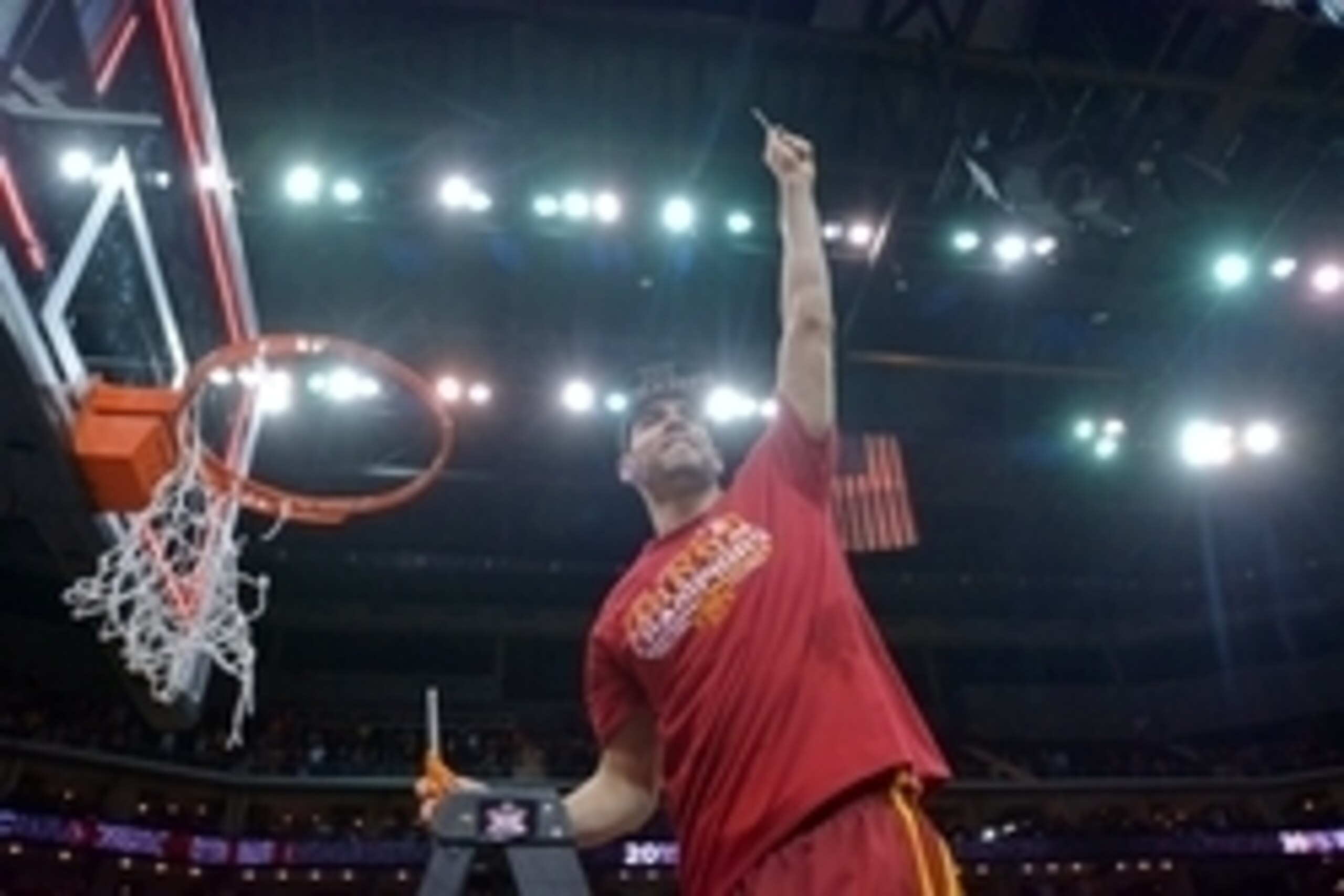 Mar 14, 2015; Kansas City, MO, USA; Iowa State Cyclones forward Georges Niang (31) cuts down a piece of the net after the game against the Kansas Jayhawks in the championship game of the Big 12 tournament at Sprint Center. Iowa State Cyclones won 70-66. M