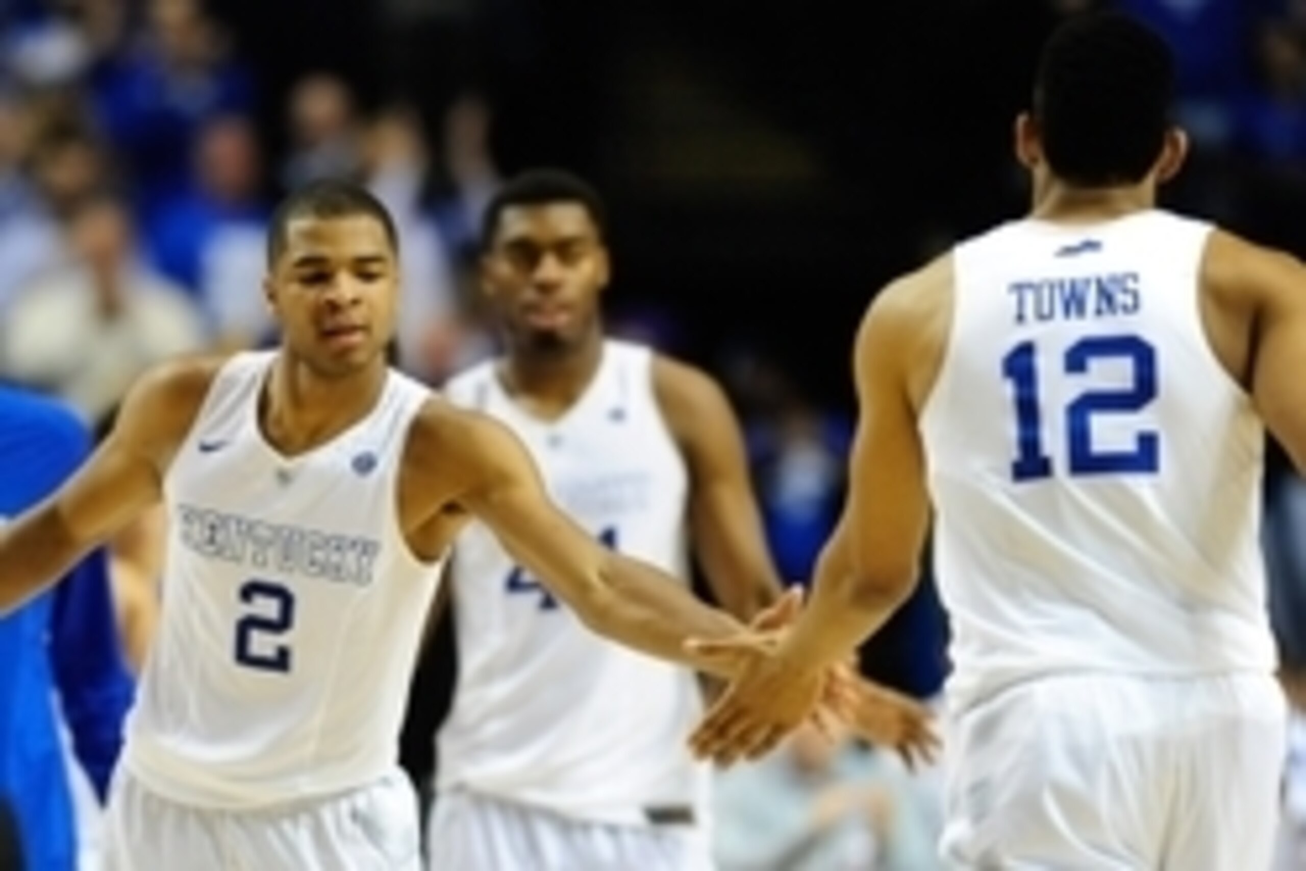 Mar 15, 2015; Nashville, TN, USA; Kentucky Wildcats guard Aaron Harrison (2) shakes hands with forward Karl-Anthony Towns (12) during the second half of the SEC Conference championship game at Bridgestone Arena. Kentucky Wildcats defeated Arkansas Razorba