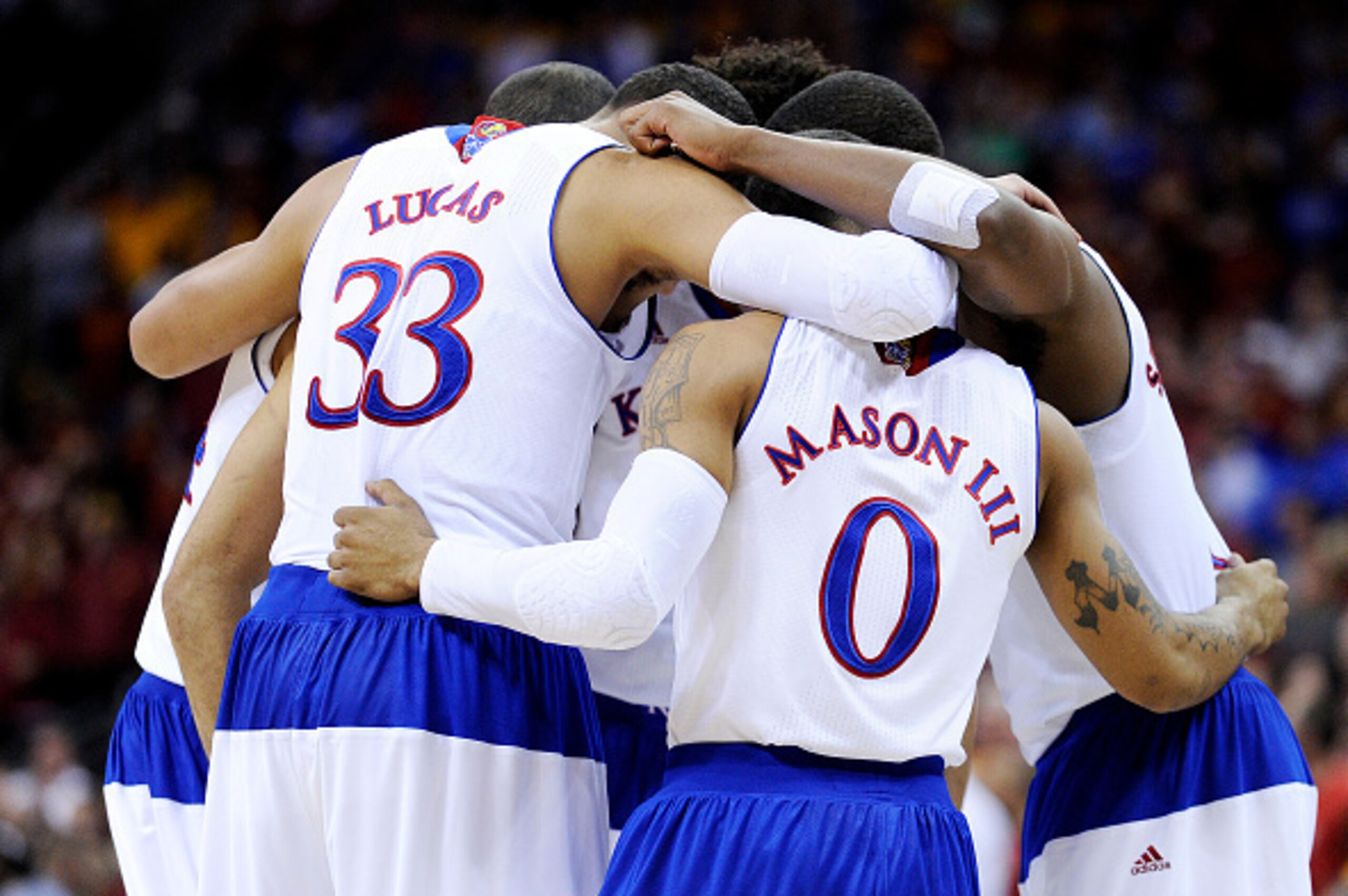 KANSAS CITY, MO - MARCH 14:  The Kansas Jayhawks huddle against the Iowa State Cyclones in the first half during the championship game of the Big 12 Basketball Tournament at Sprint Center on March 14, 2015 in Kansas City, Missouri.  (Photo by Ed Zurga/Get
