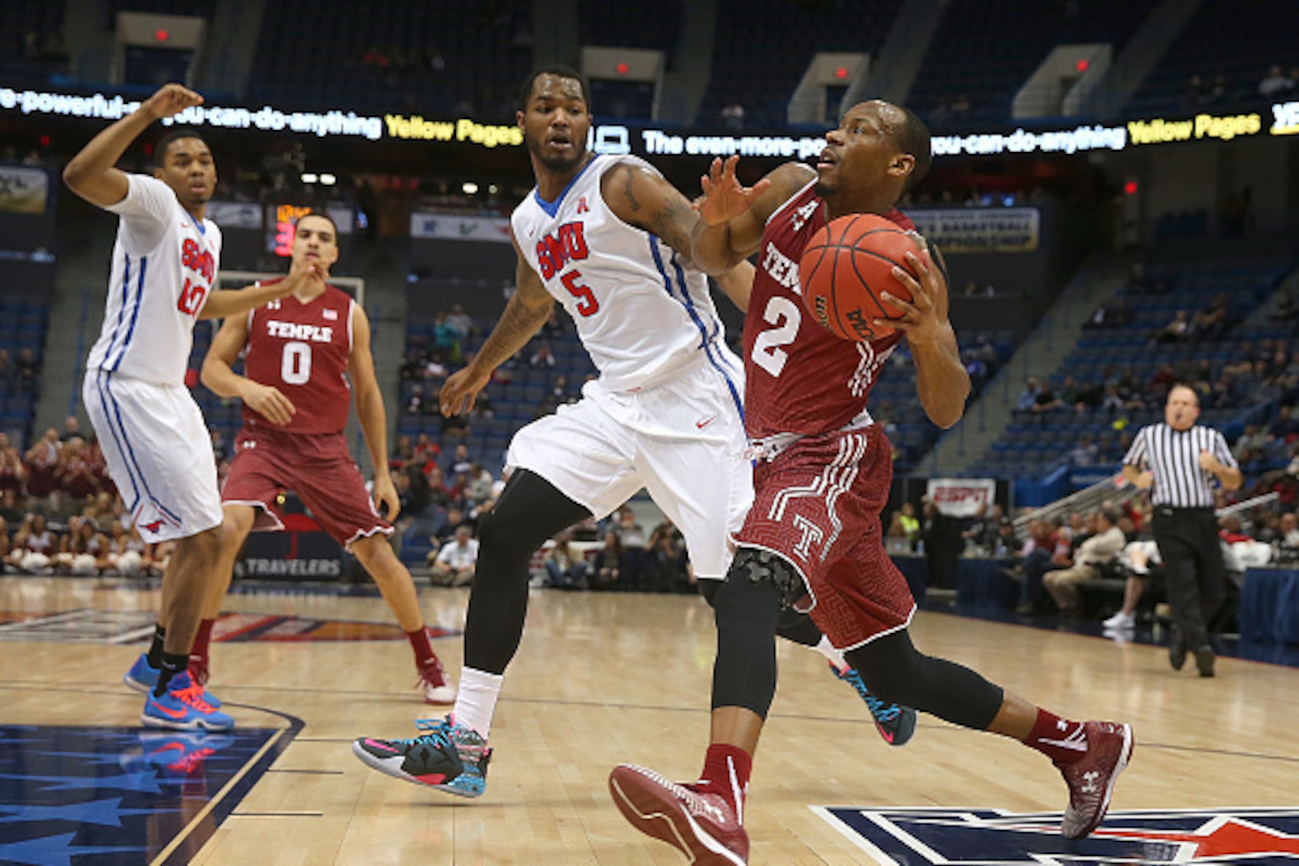 HARTFORD, CT - MARCH 14:   Markus Kennedy #5 of the Southern Methodist Mustangs defends Will Cummings #2 of the Temple Owls during a semifinal game in the 2015 AAC Championships at the XL Center on March 14, 2015 in Hartford, Connecticut. (Photo by Jim Ro