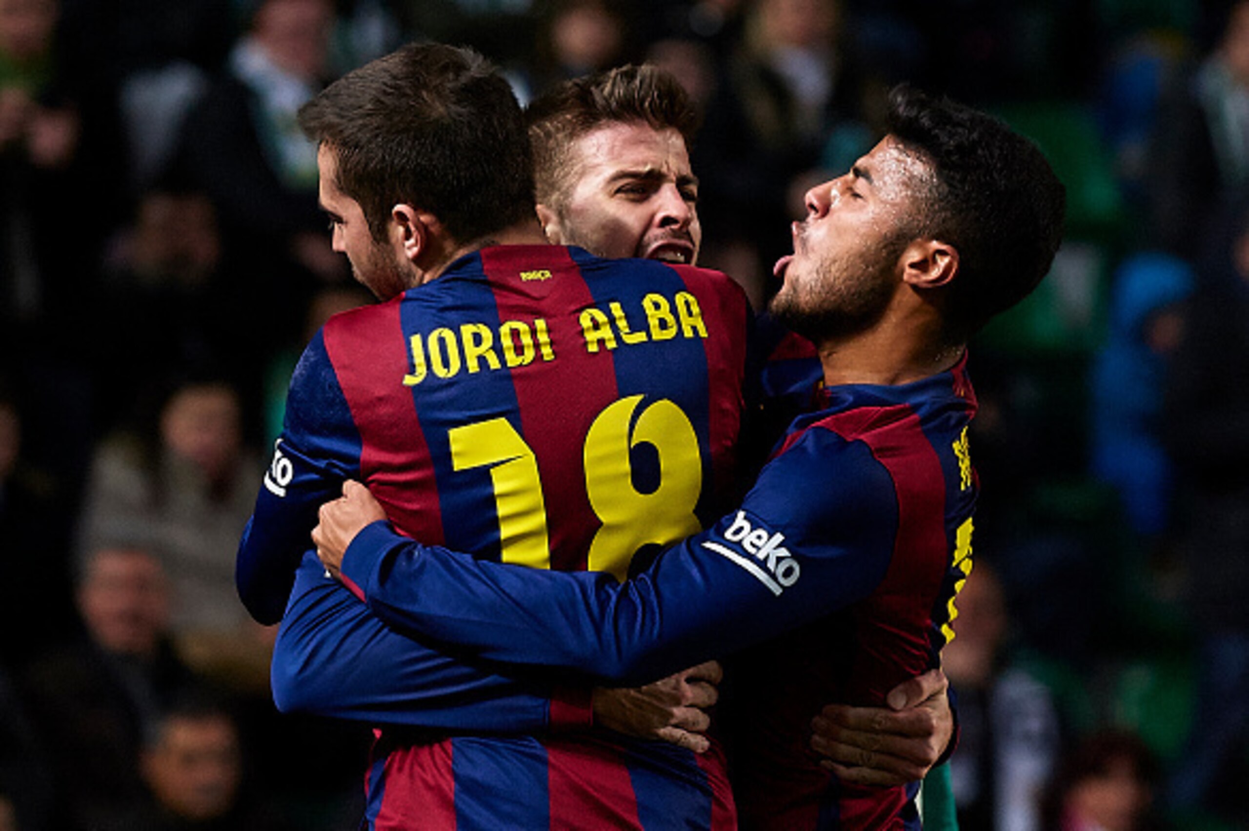ELCHE, SPAIN - JANUARY 24:  Gerard Pique of Barcelona celebrate scoring with his teammates Jordi Alba and Rafinha (R) during the La Liga match between Elche FC and FC Barcelona at Estadio Manuel Martinez Valero on January 24, 2015 in Elche, Spain.  (Photo