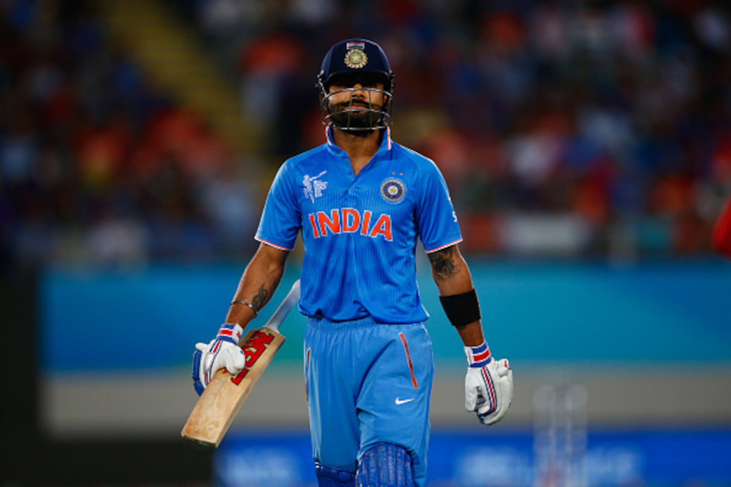 AUCKLAND, NEW ZEALAND - MARCH 14:  Virat Kohli of India leave the field after being bowled by Sikandar Raza of Zimbabwe Virat Kohli of India  during the 2015 ICC Cricket World Cup match between India and Zimbabwe at Eden Park on March 14, 2015 in Auckland