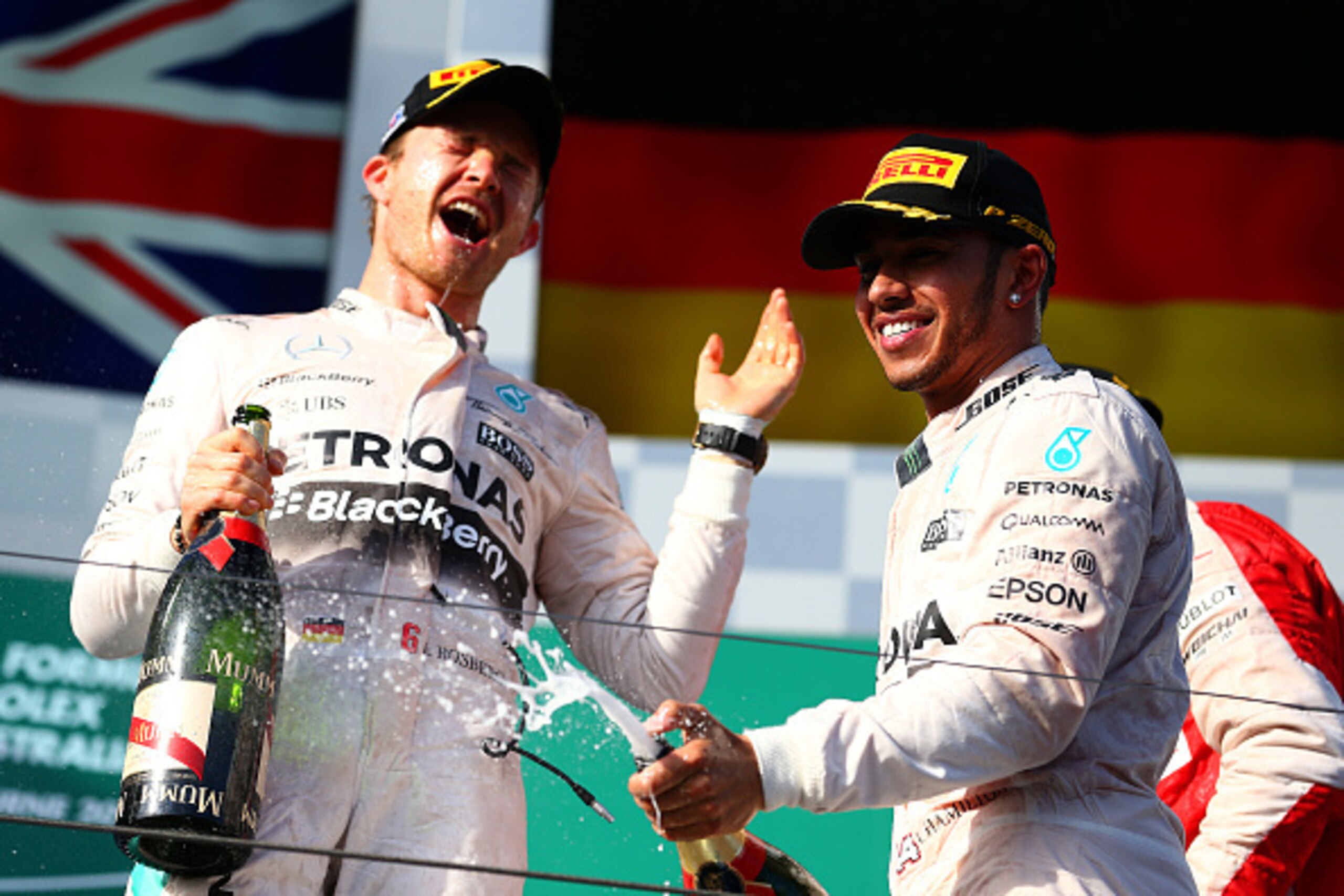 MELBOURNE, AUSTRALIA - MARCH 15:  Lewis Hamilton of Great Britain and Mercedes GP celebrates on the podium next to Nico Rosberg of Germany and Mercedes GP after winning the Australian Formula One Grand Prix at Albert Park on March 15, 2015 in Melbourne, A
