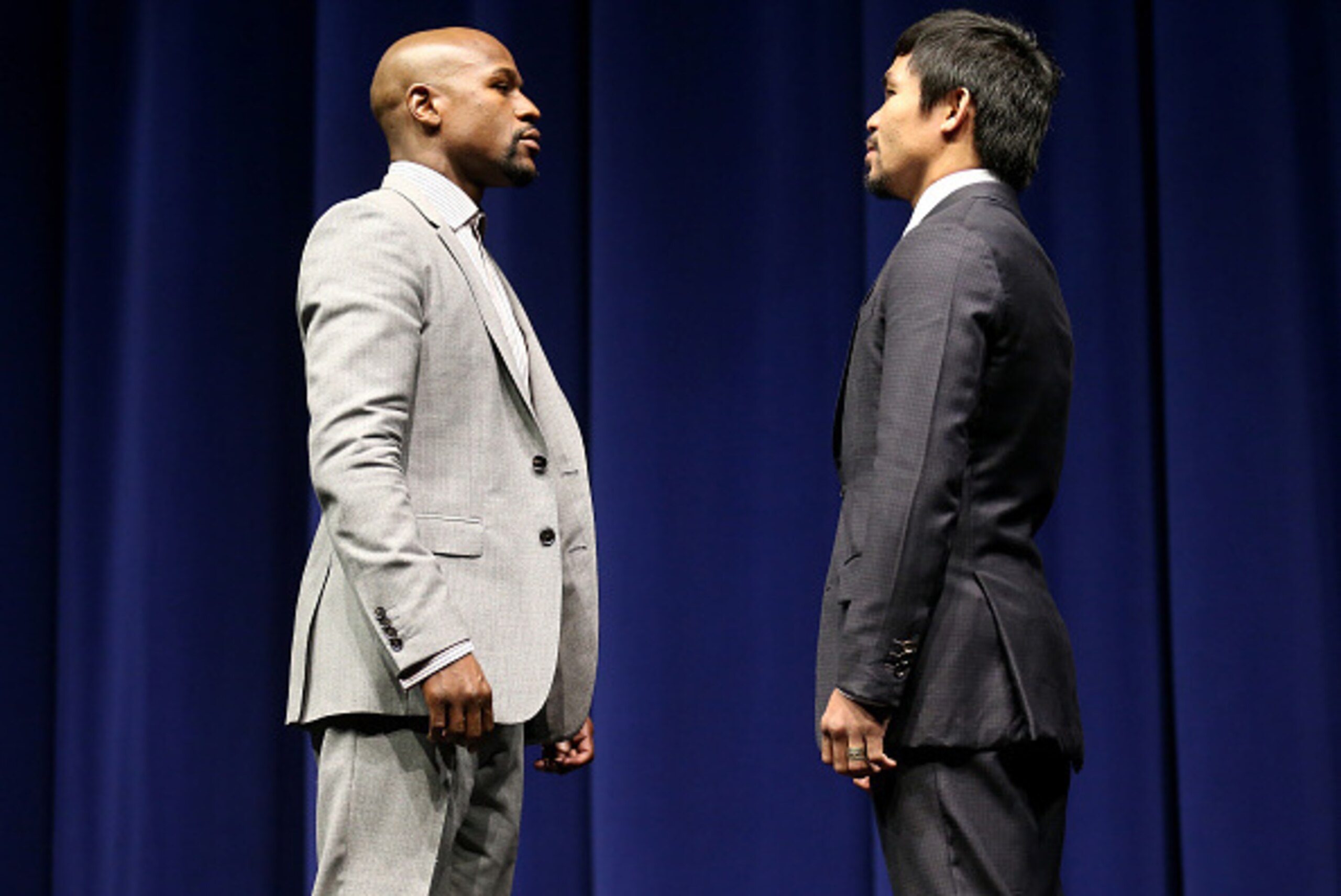 LOS ANGELES, CA - MARCH 11:  Floyd Mayweather (L) and Manny Pacquiao face off at the start of their Press Conference promoting their upcoming fight on March 11, 2015 in Los Angeles, California.  (Photo by Stephen Dunn/Getty Images)