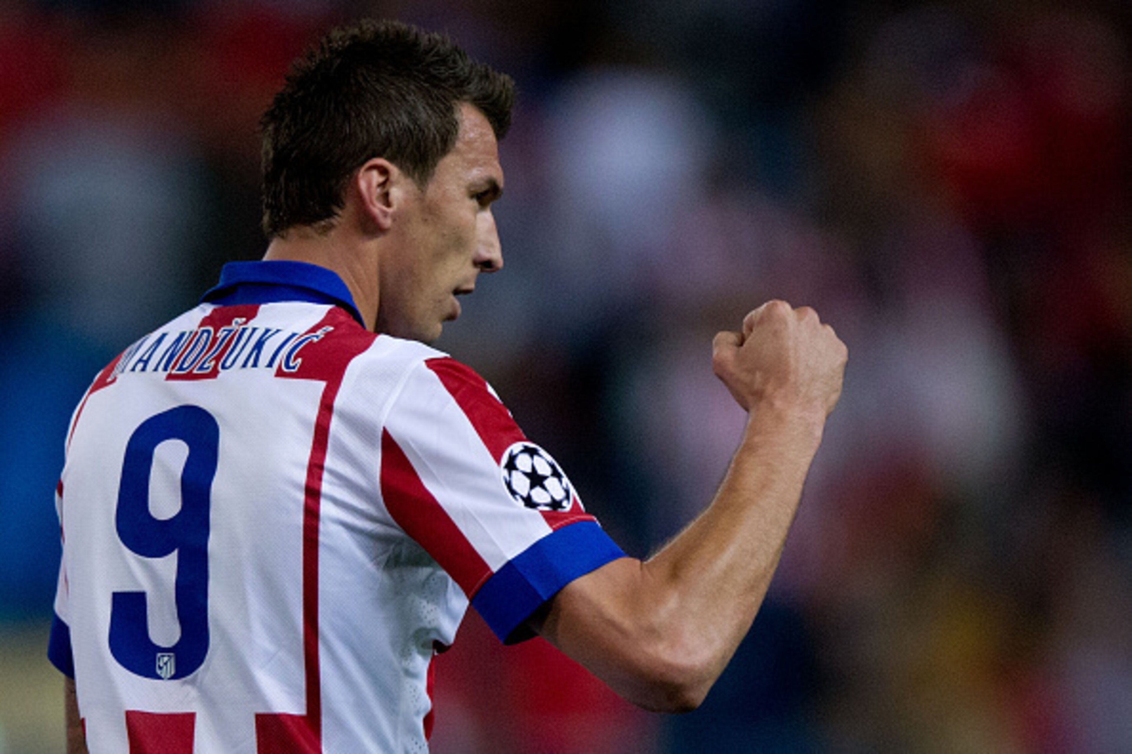 MADRID, SPAIN - OCTOBER 22: Mario Mandzukic of Atletico de Madrid celebrates scoring their second goal during the UEFA Champions League group A match between Club Atletico de Madrid and Malmo FF at Vicente Calderon stadium on October 22, 2014 in Madrid, S